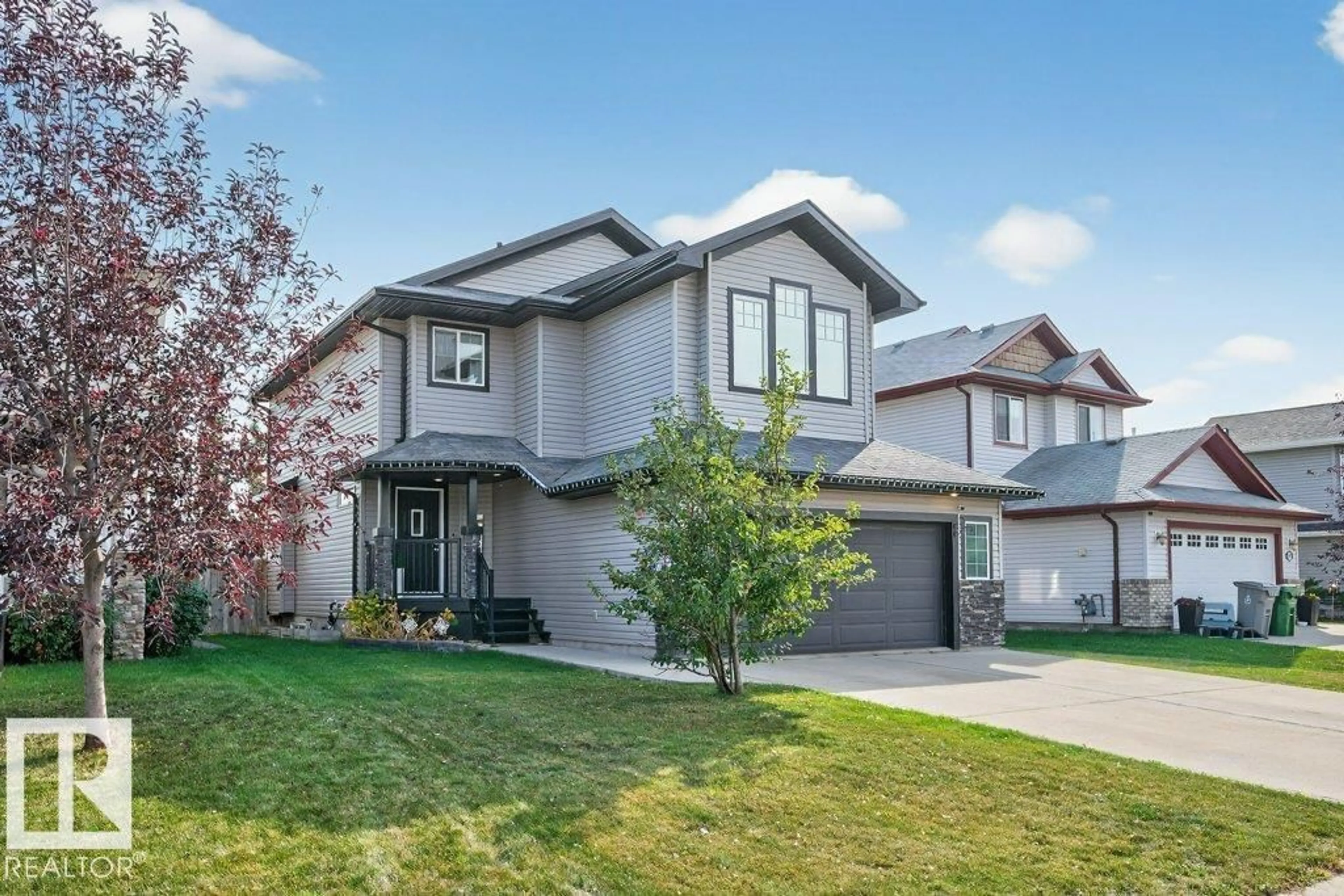 Home with vinyl exterior material, street for 9407 81 AV, Morinville Alberta T8R0A9