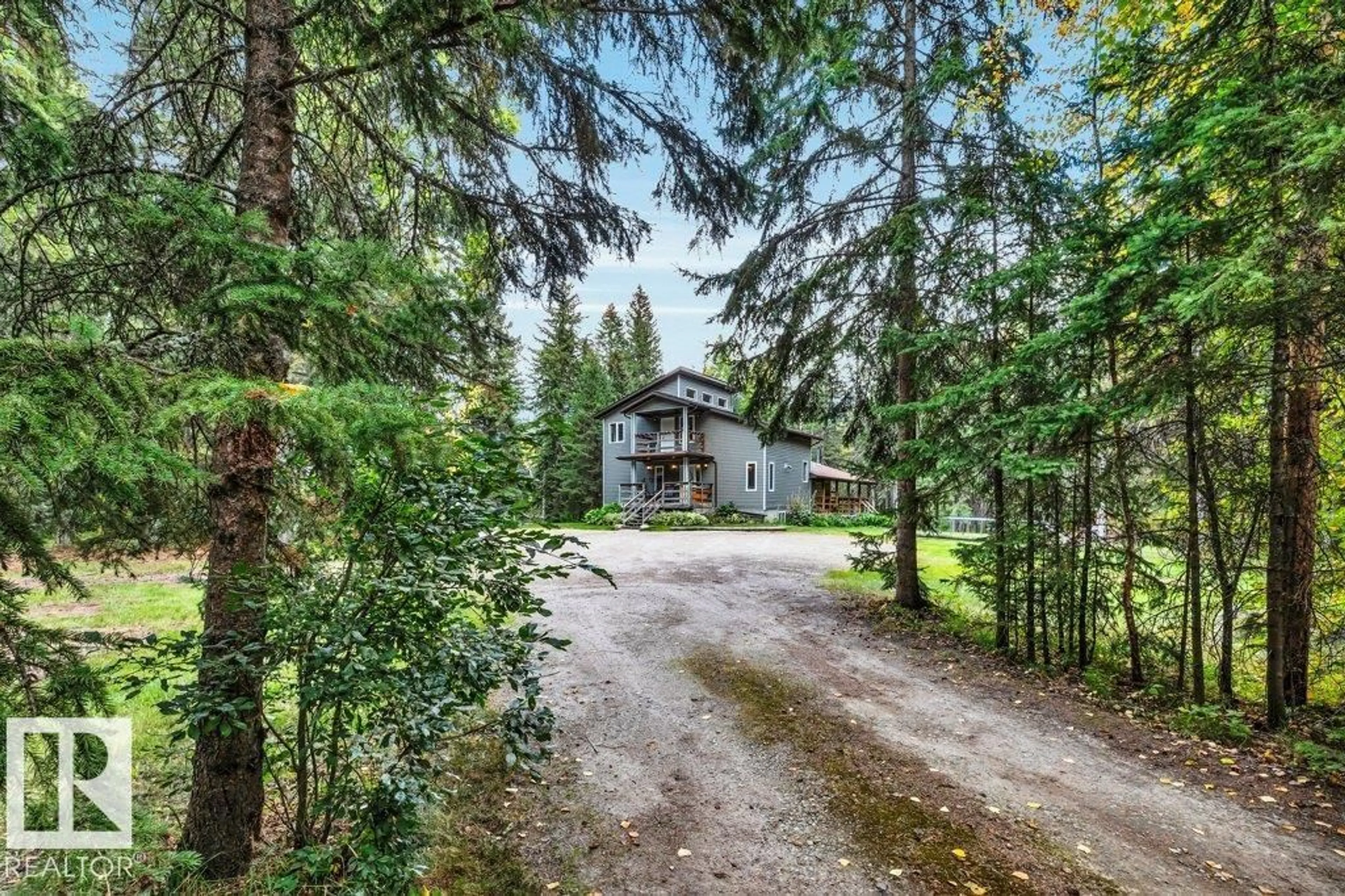 A pic from outside/outdoor area/front of a property/back of a property/a pic from drone, forest/trees view for 771 - 121 45304 HWY, Rural Wetaskiwin County Alberta T0C2V0