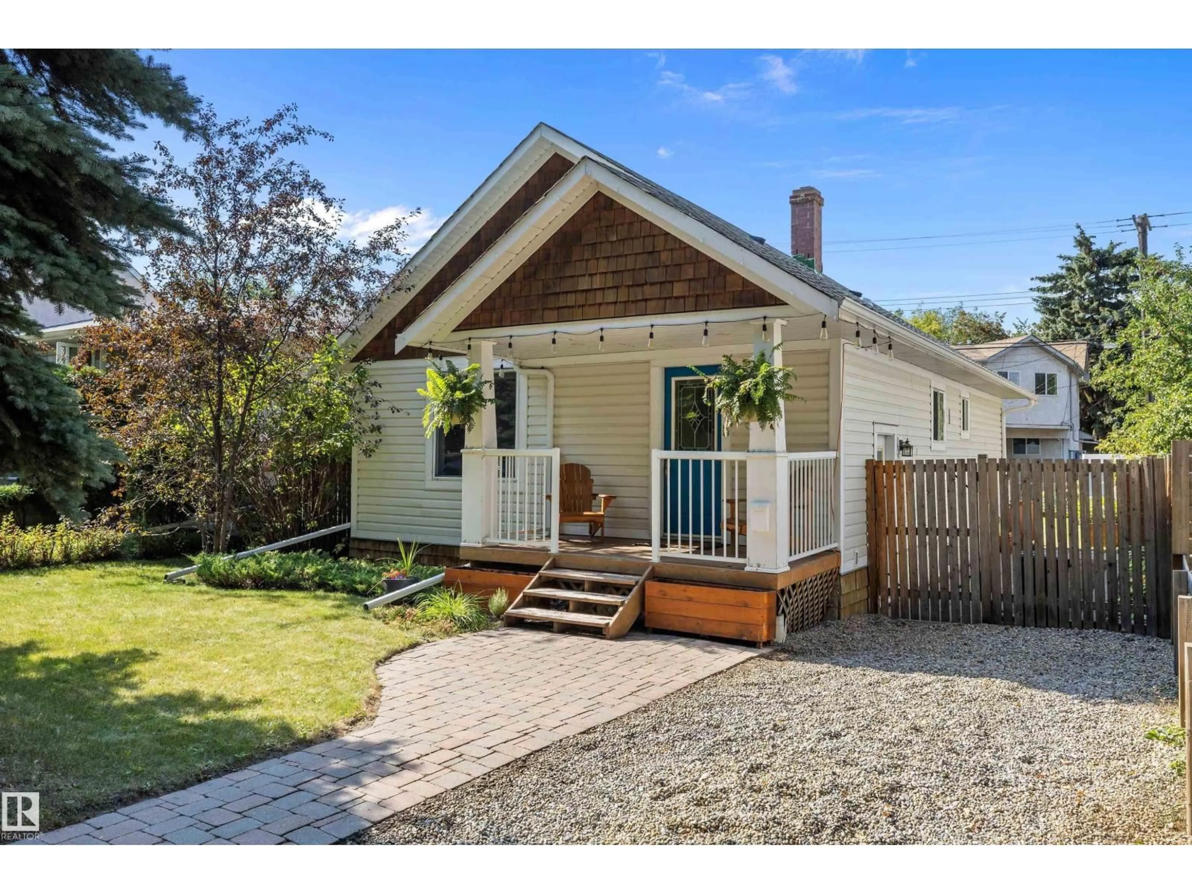 Home with vinyl exterior material, street for NW - 9336 91 ST, Edmonton Alberta T6C3P1