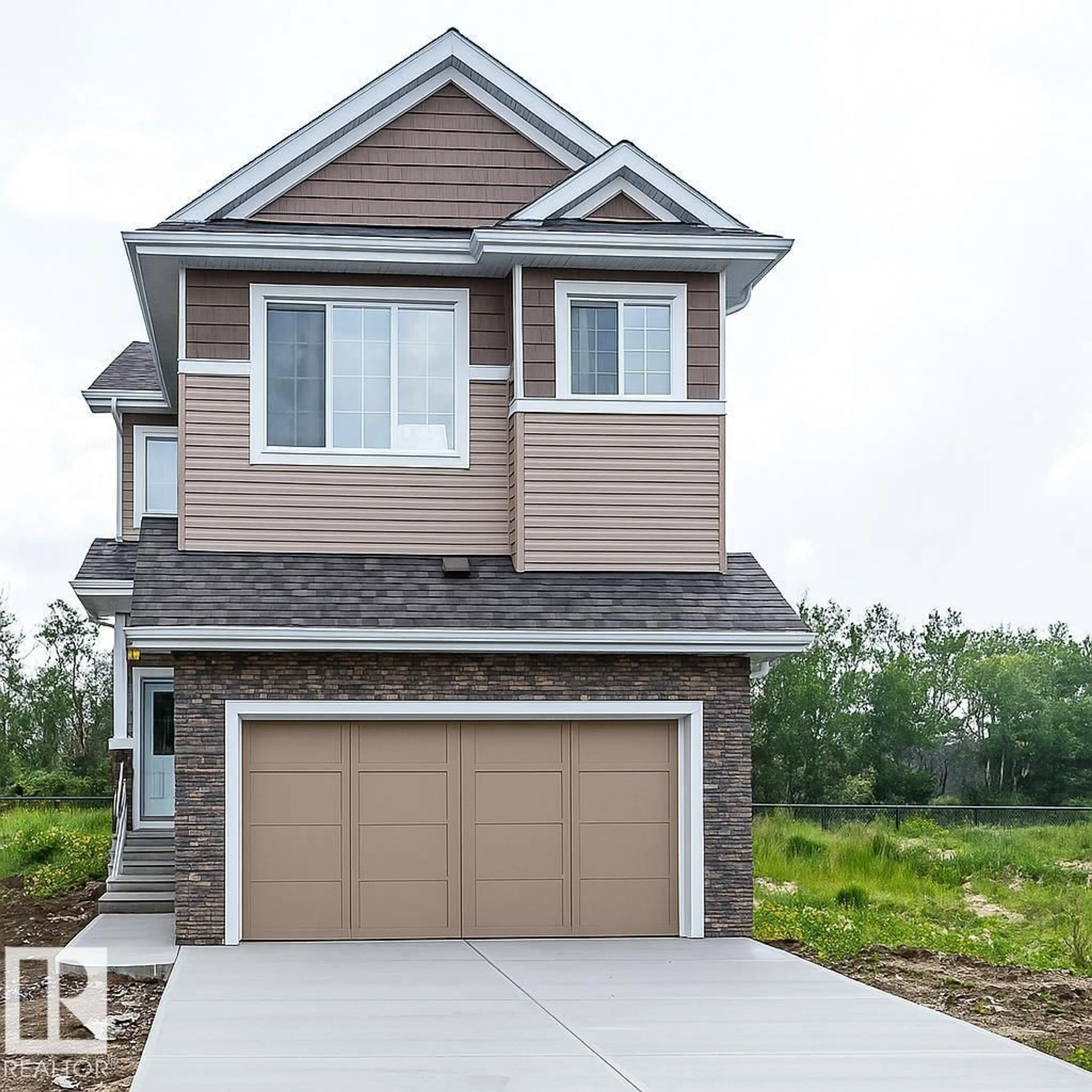 Home with vinyl exterior material, street for 6235 175 AV, Edmonton Alberta T5Y0K8