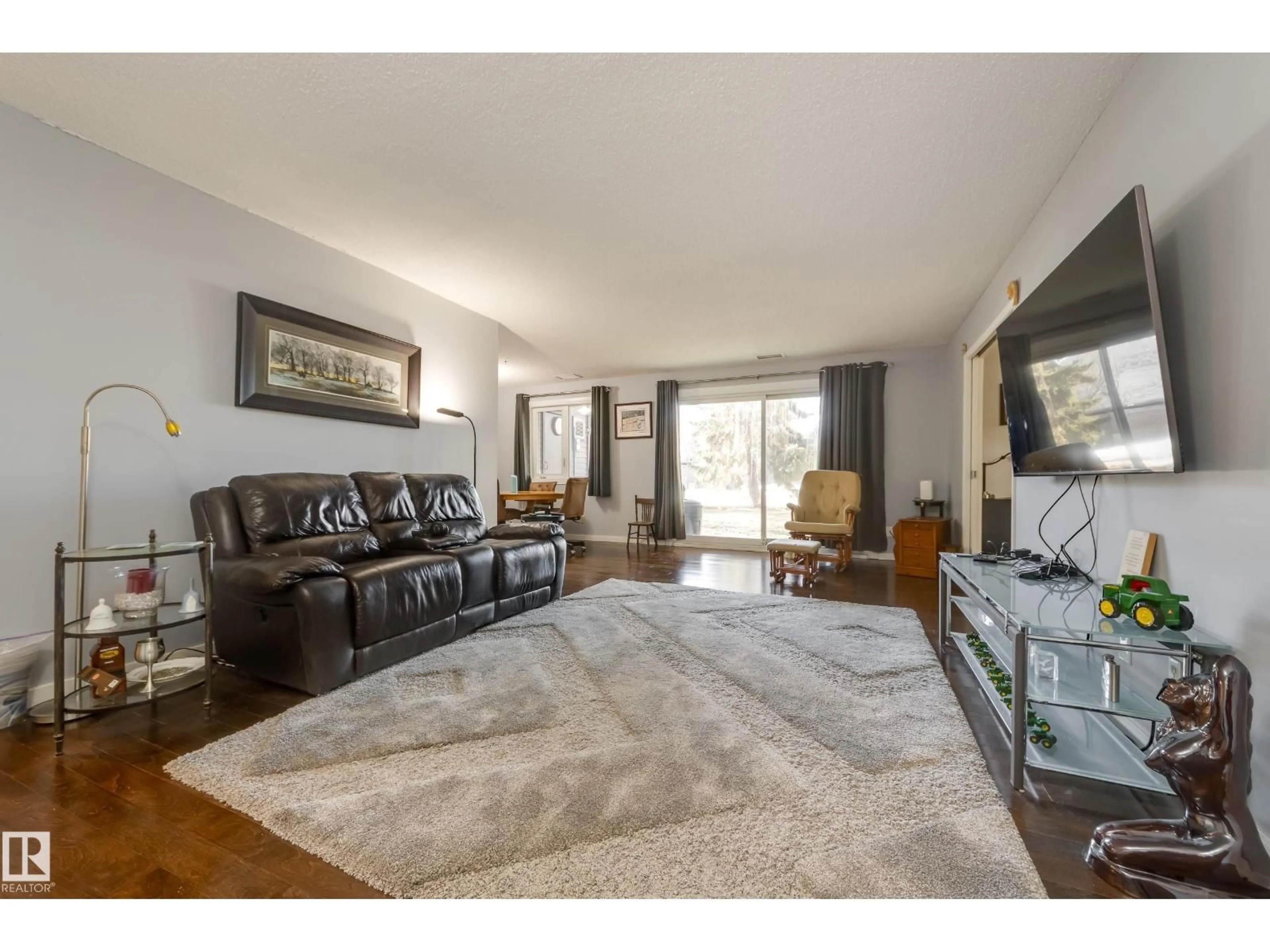 Living room with furniture, unknown for #108 - 14810 51 AV NW, Edmonton Alberta T6H5G5