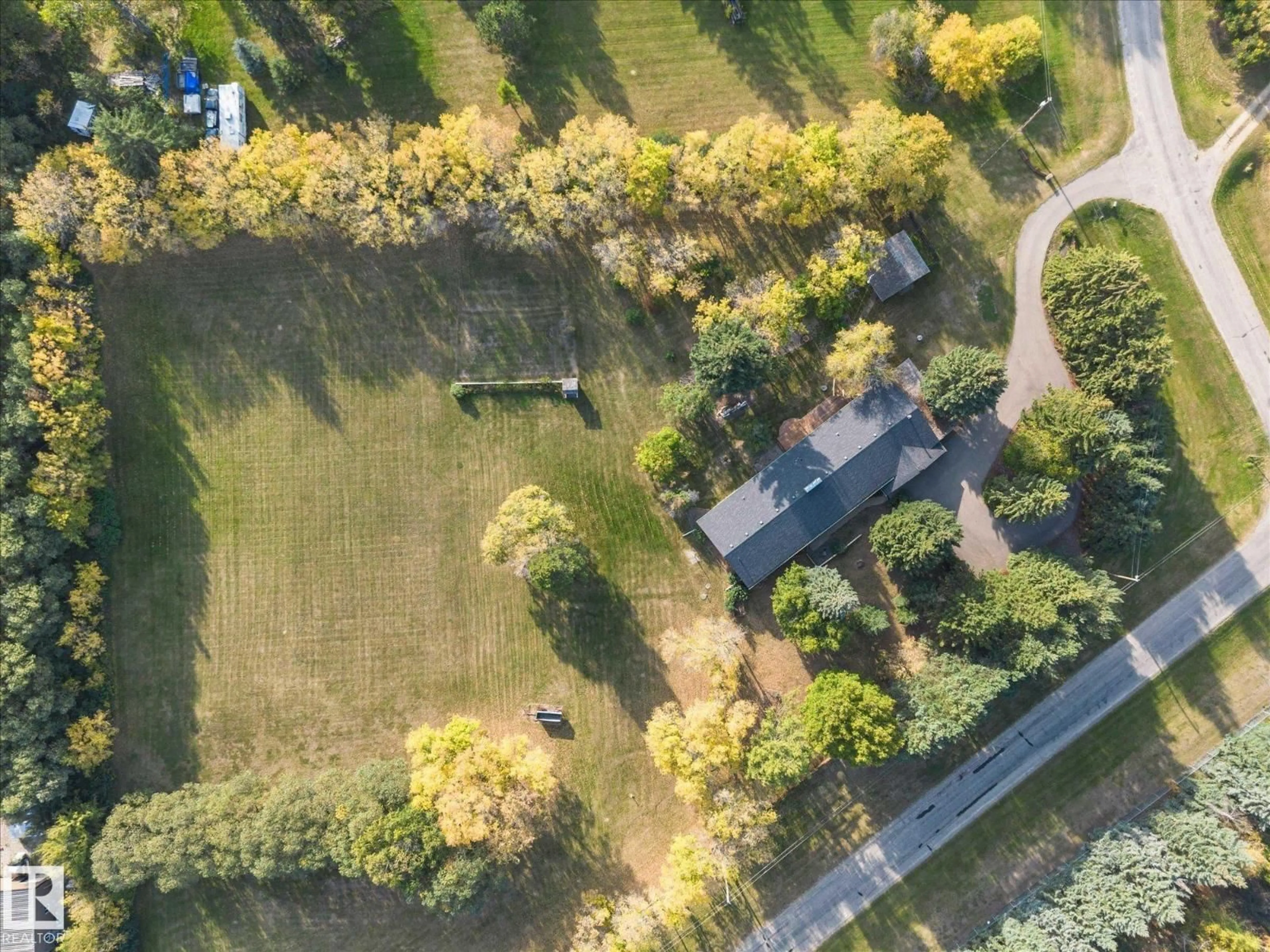 A pic from outside/outdoor area/front of a property/back of a property/a pic from drone, street for 46 52224 RGE ROAD 275, Rural Parkland County Alberta T7Y2V7