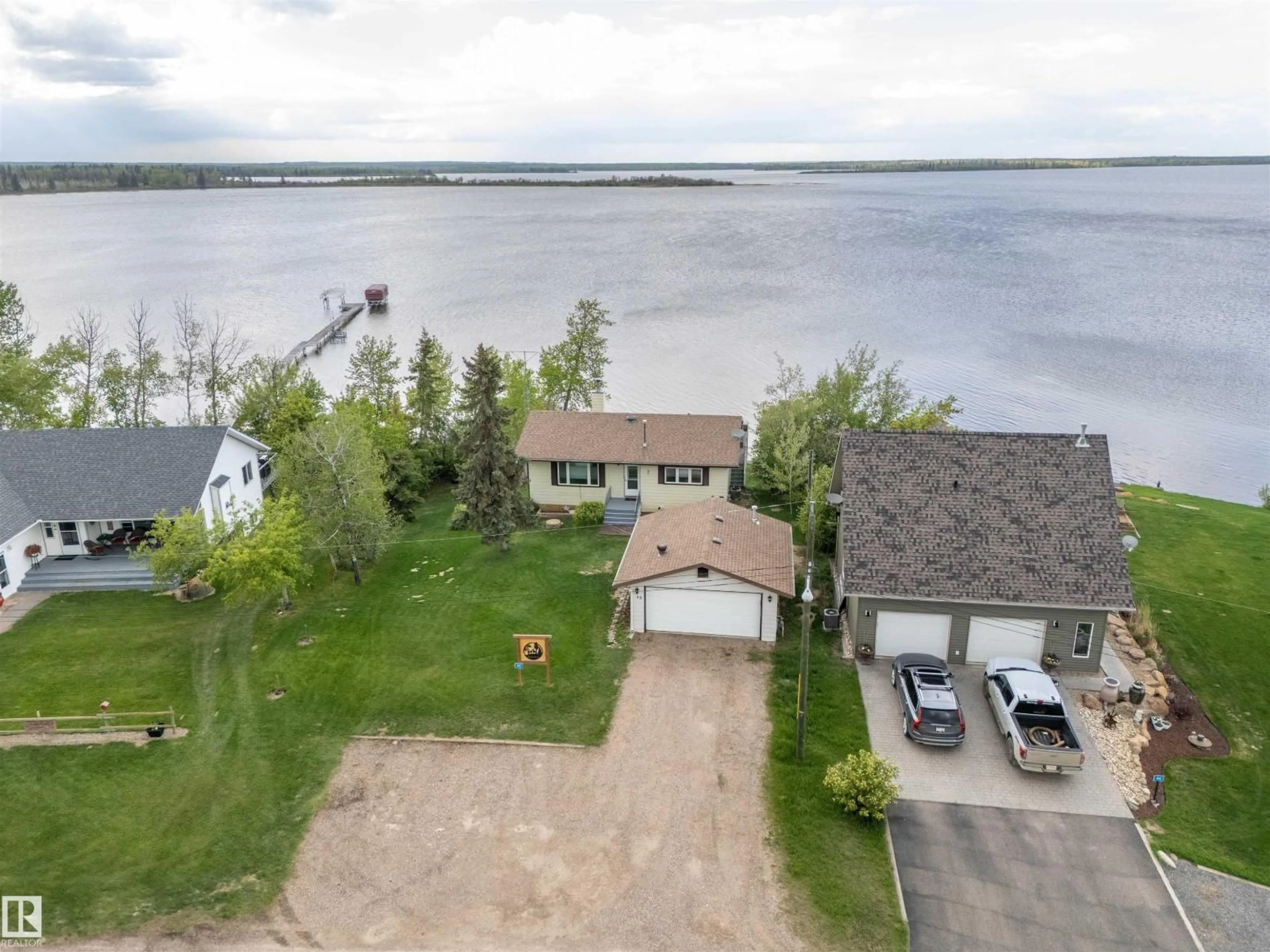 A pic from outside/outdoor area/front of a property/back of a property/a pic from drone, water/lake/river/ocean view for 48 47018 TWP RD 604A, Rural Bonnyville M.D. Alberta T9N2J3
