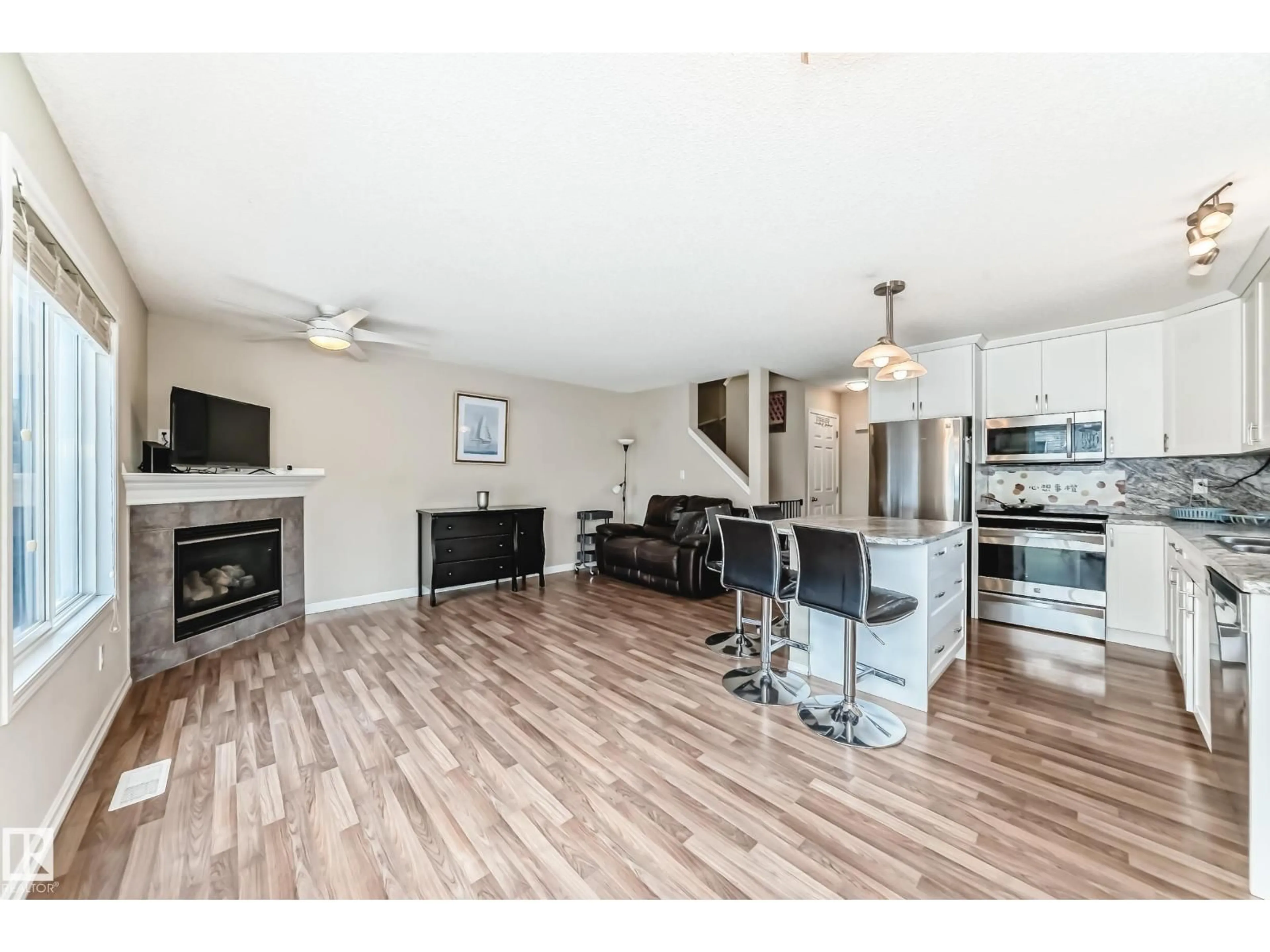 Open concept kitchen, wood/laminate floor for 5101 - 46 SOLEIL BV, Beaumont Alberta T4X0C3