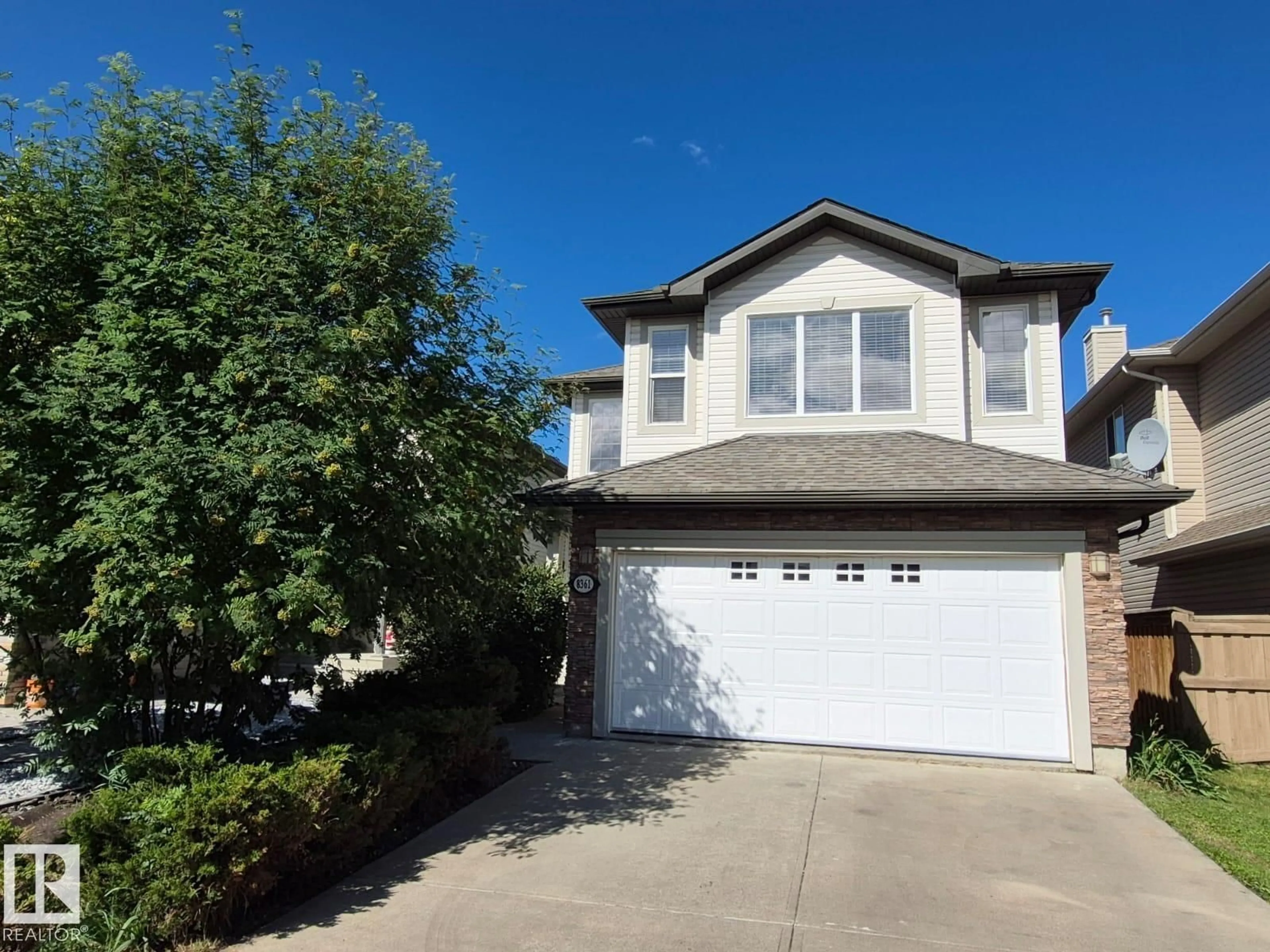 Home with vinyl exterior material, street for 8361 SHASKE CR, Edmonton Alberta T6R0B4