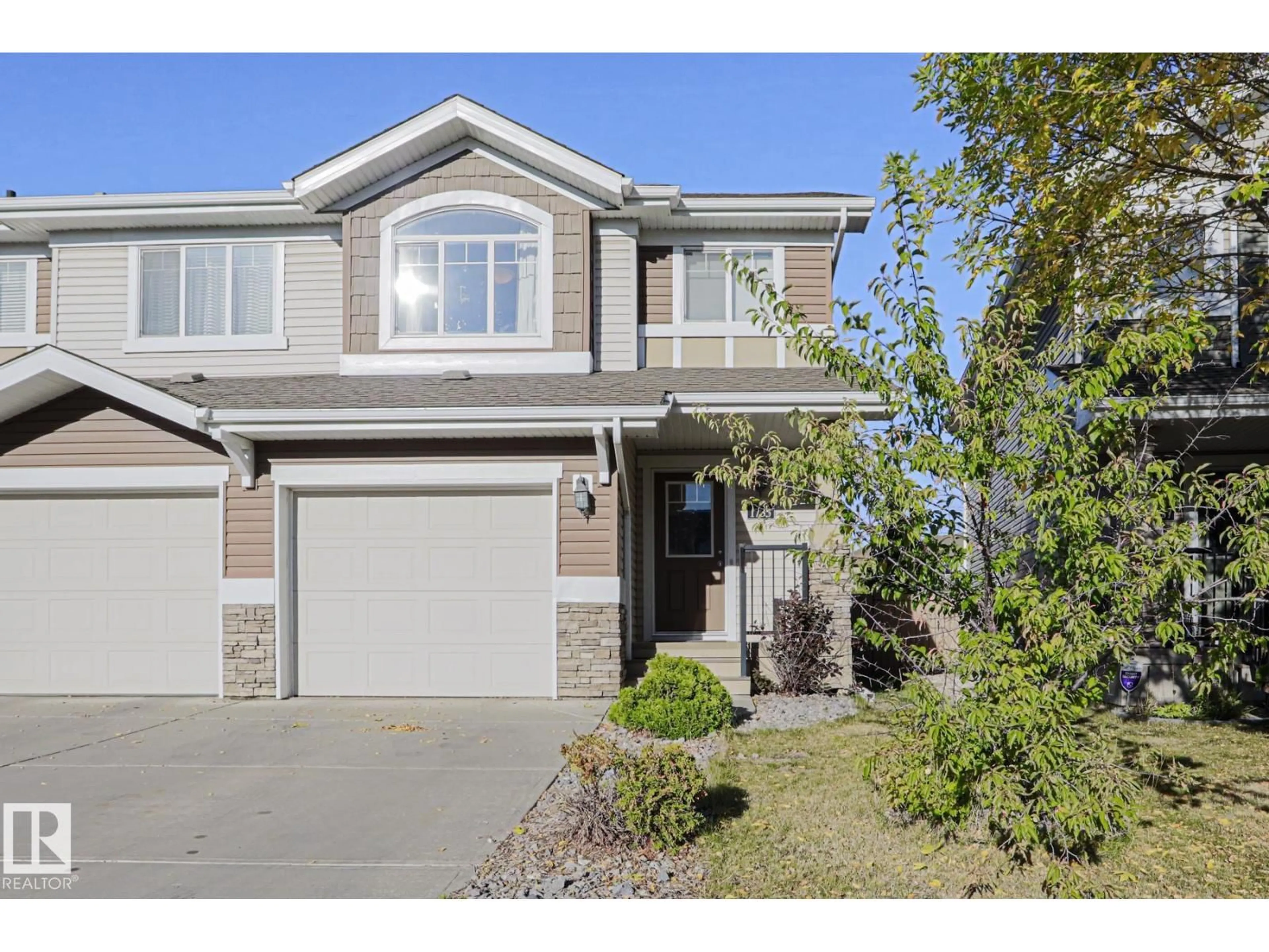 Home with vinyl exterior material, street for 1735 HAMMOND CR, Edmonton Alberta T6M0K4