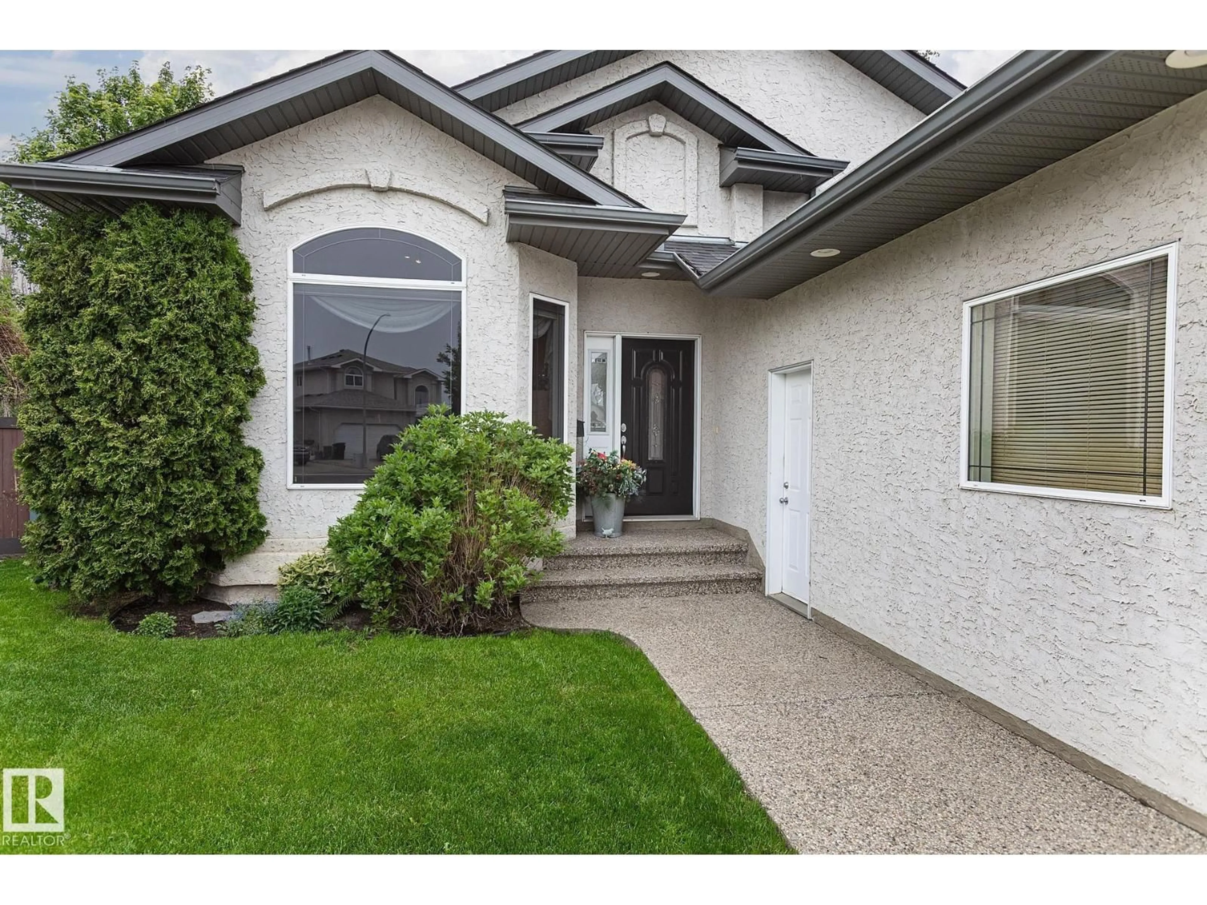 Home with vinyl exterior material, street for NW - 16135 72 ST, Edmonton Alberta T5Z3T8