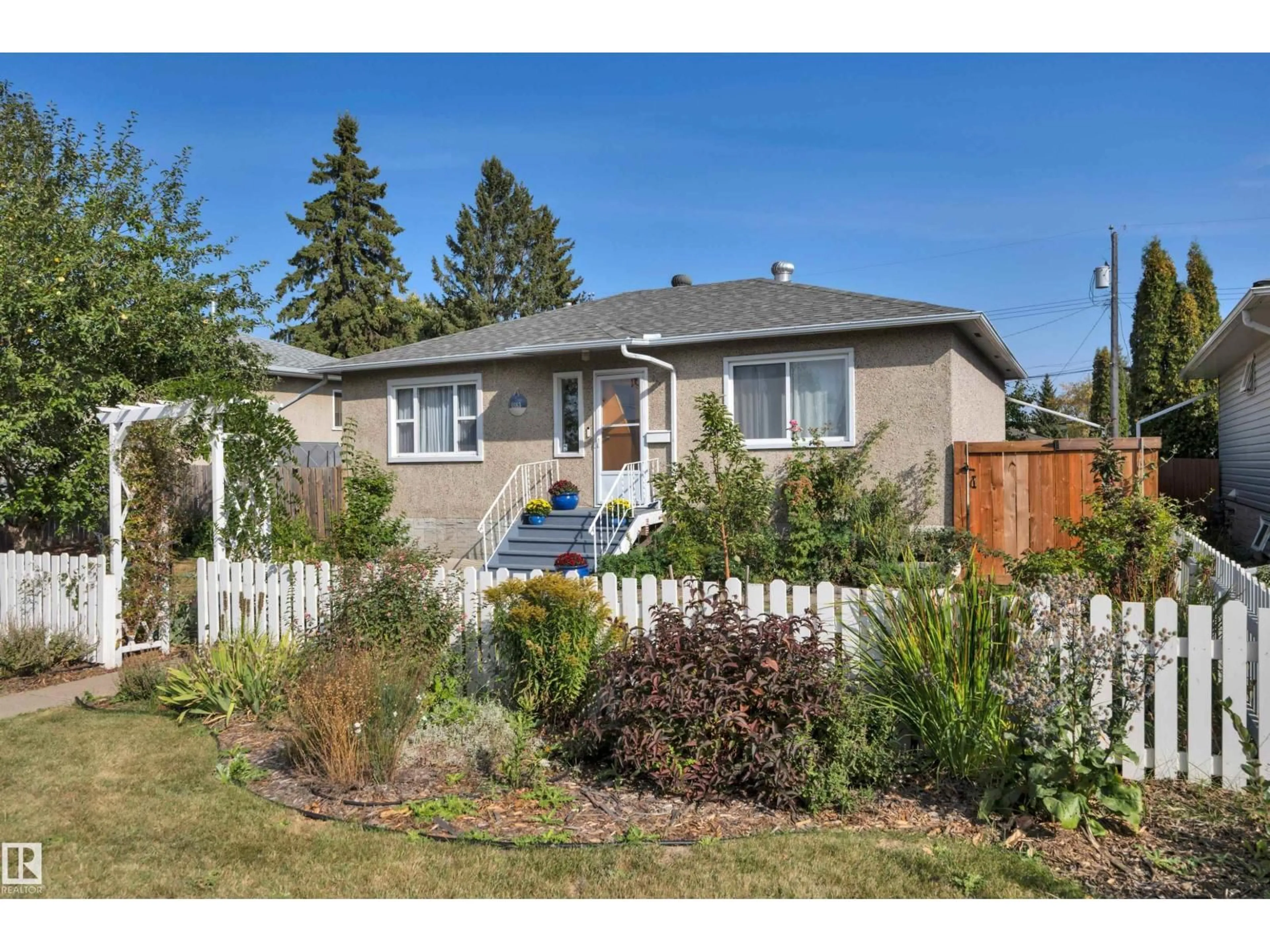 Home with vinyl exterior material, street for 11163 118 ST, Edmonton Alberta T5G2W8