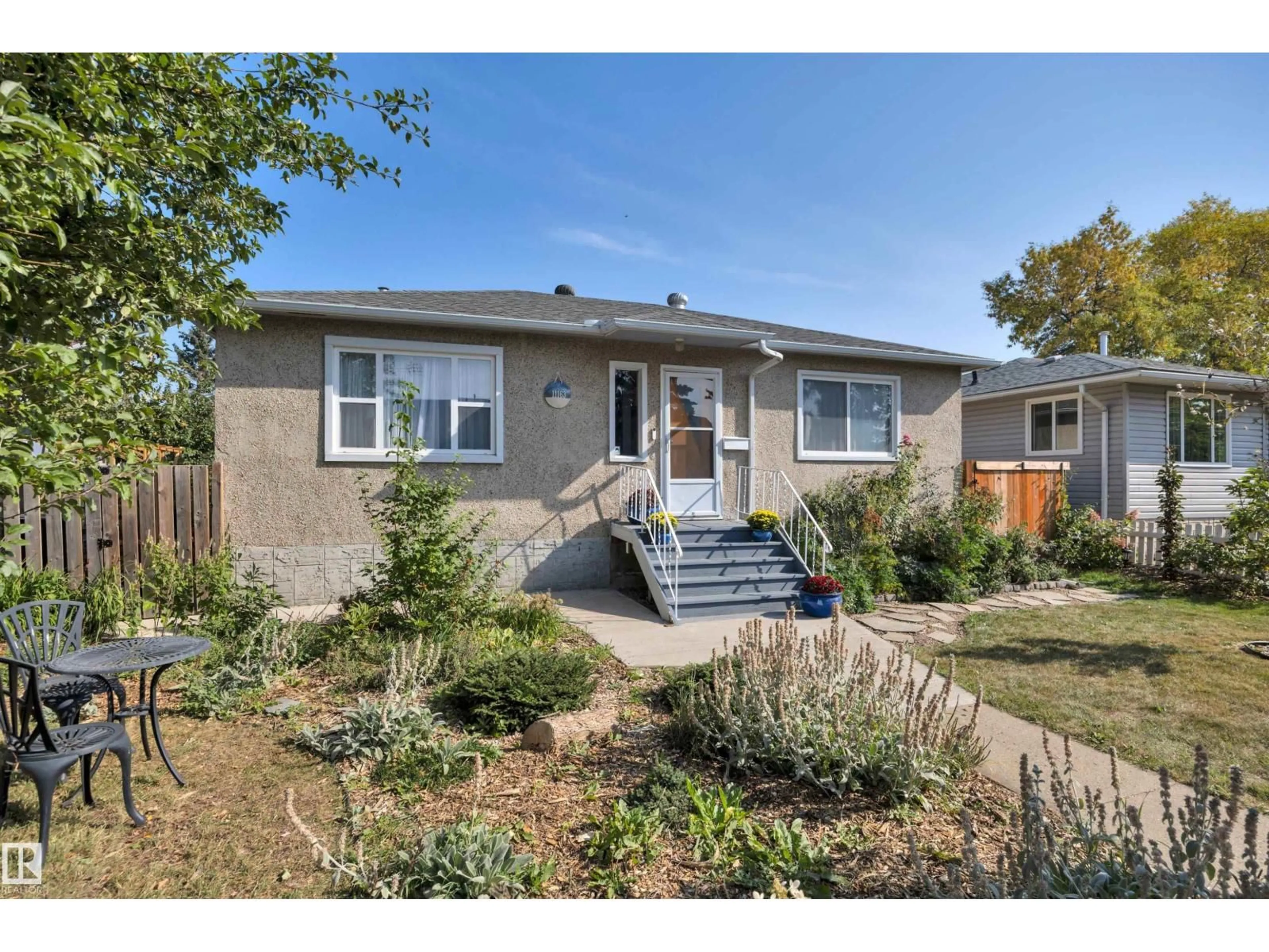 Home with vinyl exterior material, street for 11163 118 ST, Edmonton Alberta T5G2W8