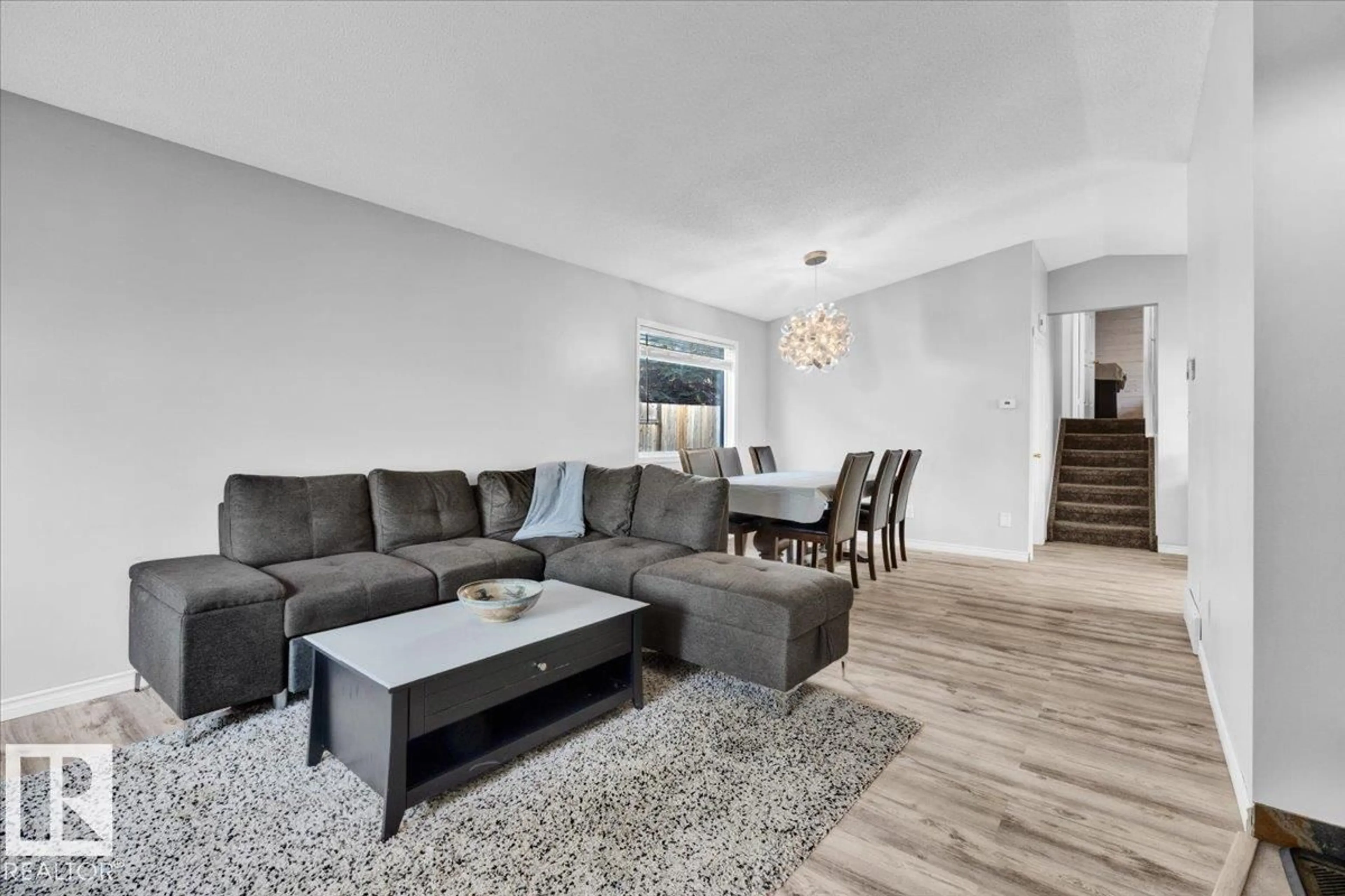 Living room with furniture, unknown for 3619 27 AV, Edmonton Alberta T6L6C5