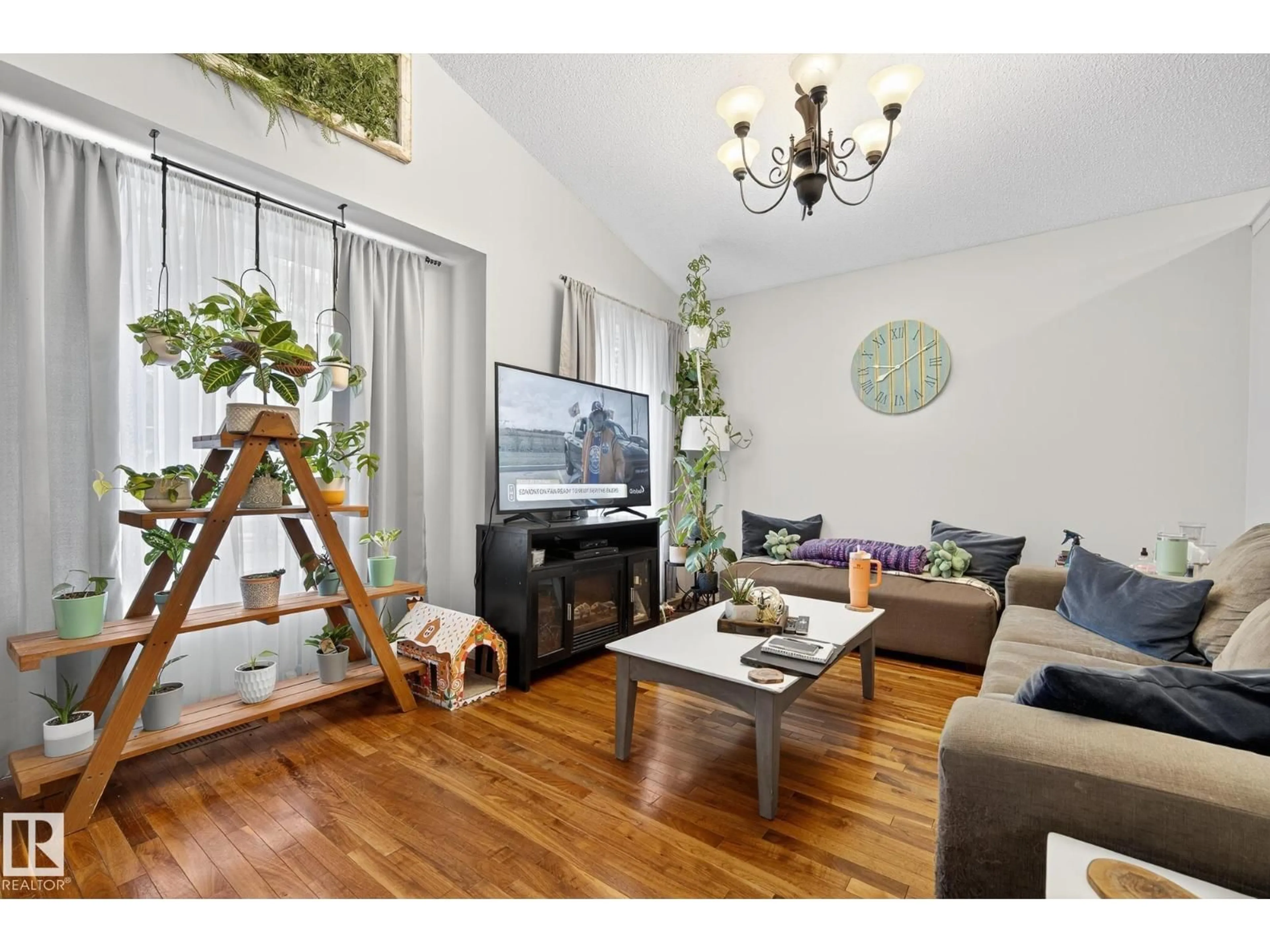Living room with furniture, wood/laminate floor for 3021 TRELLE CR, Edmonton Alberta T6R3M8