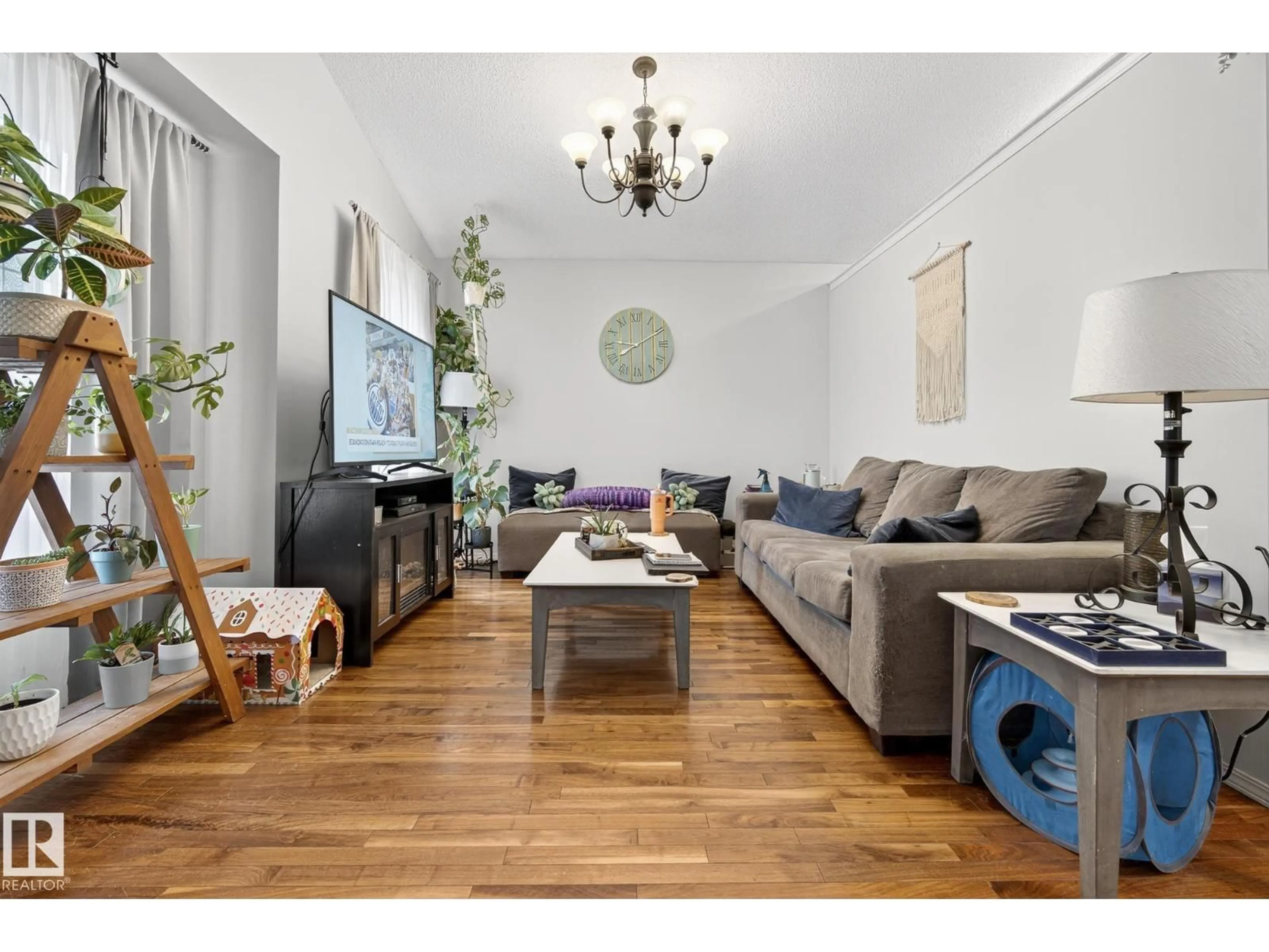 Living room with furniture, wood/laminate floor for 3021 TRELLE CR, Edmonton Alberta T6R3M8