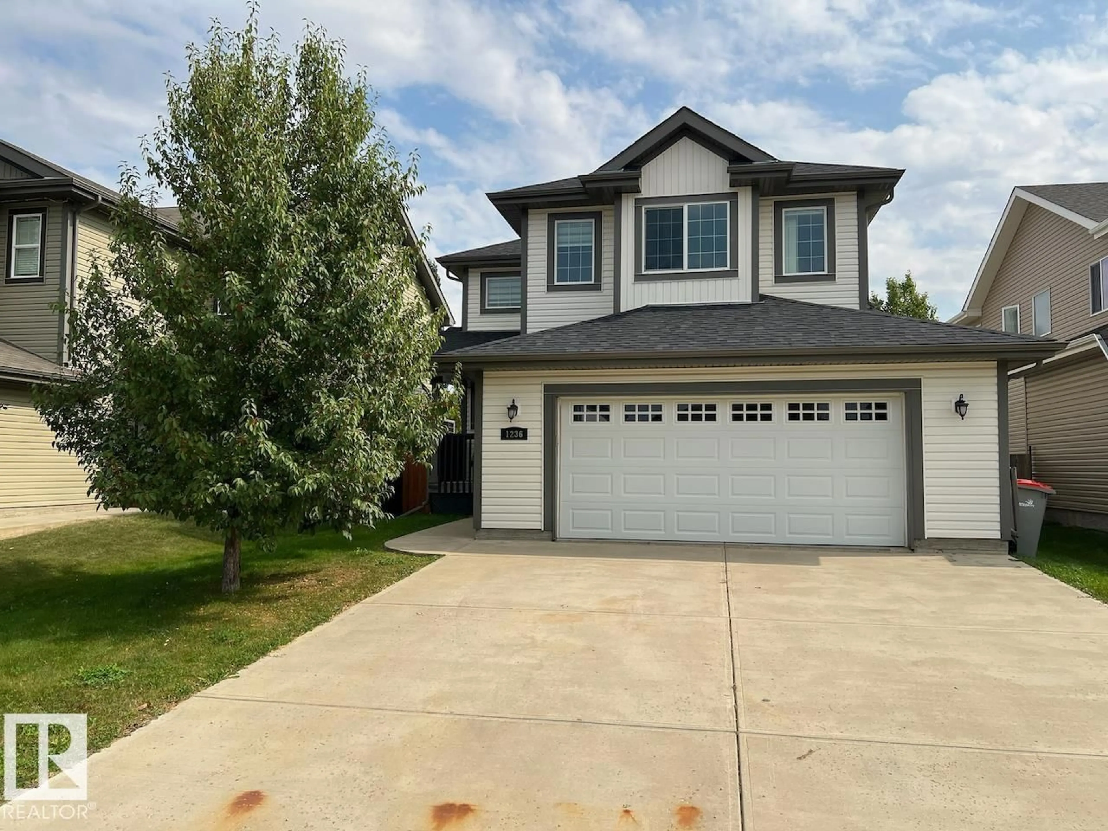 Home with vinyl exterior material, street for 1236 WESTERRA CR, Stony Plain Alberta T7Z0B2