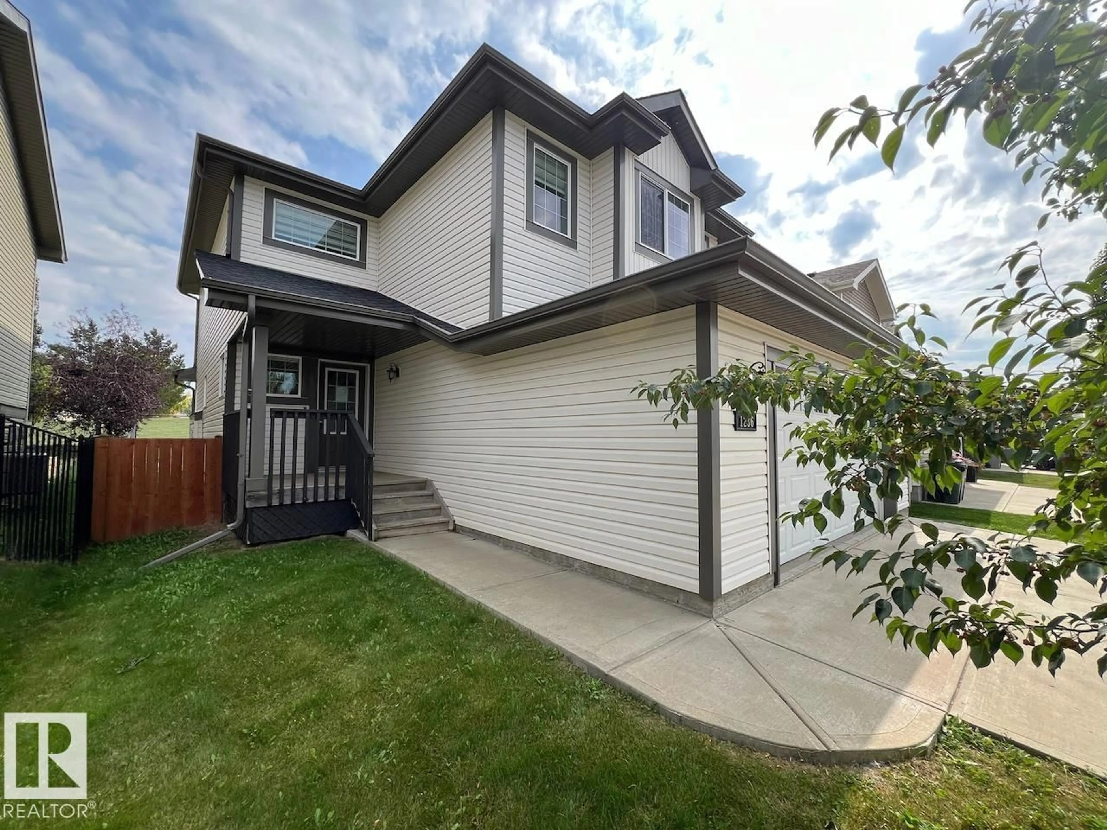 Home with vinyl exterior material, street for 1236 WESTERRA CR, Stony Plain Alberta T7Z0B2