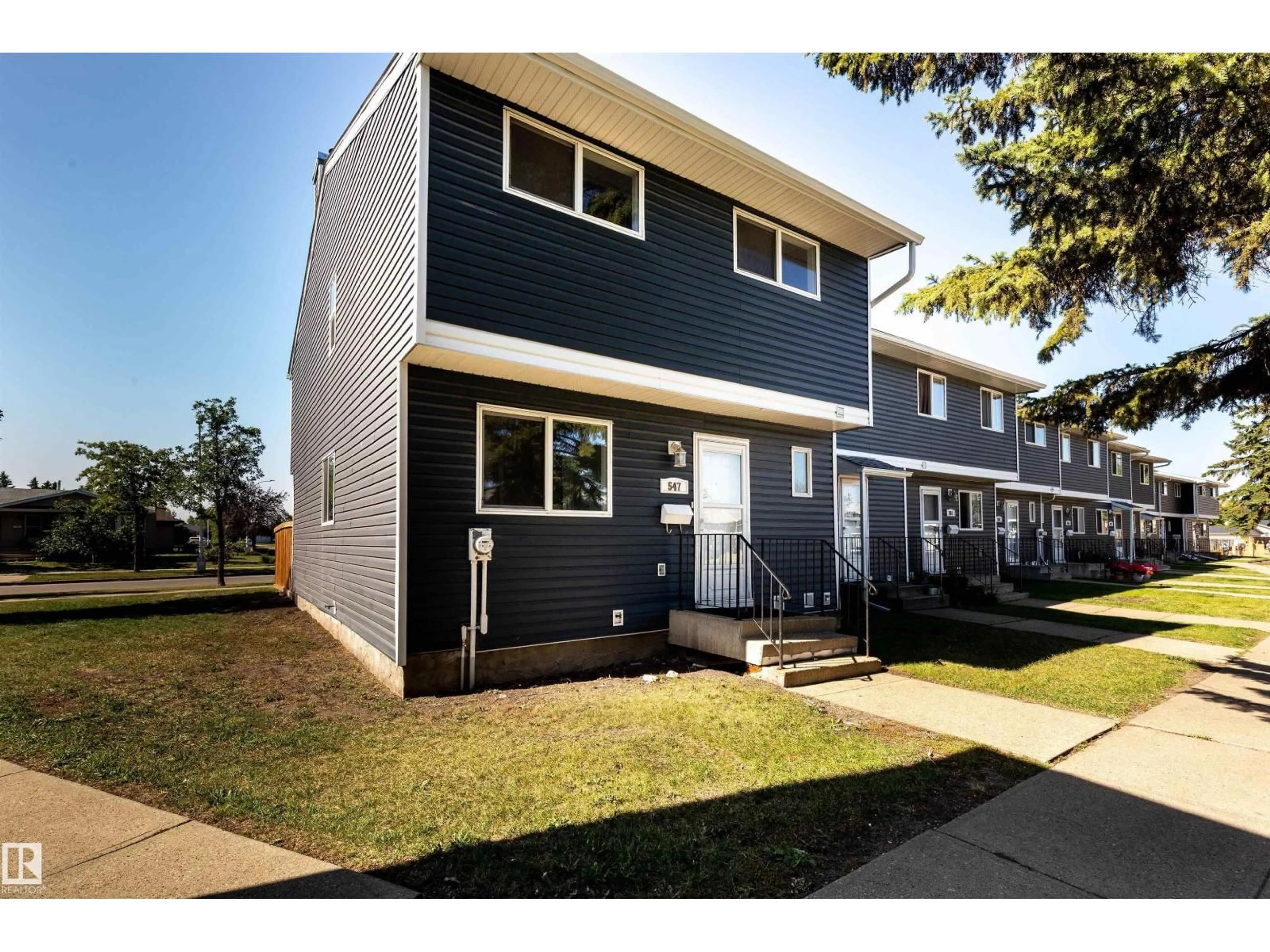 Home with vinyl exterior material, street for 547 DUNLUCE RD, Edmonton Alberta T5X4P4