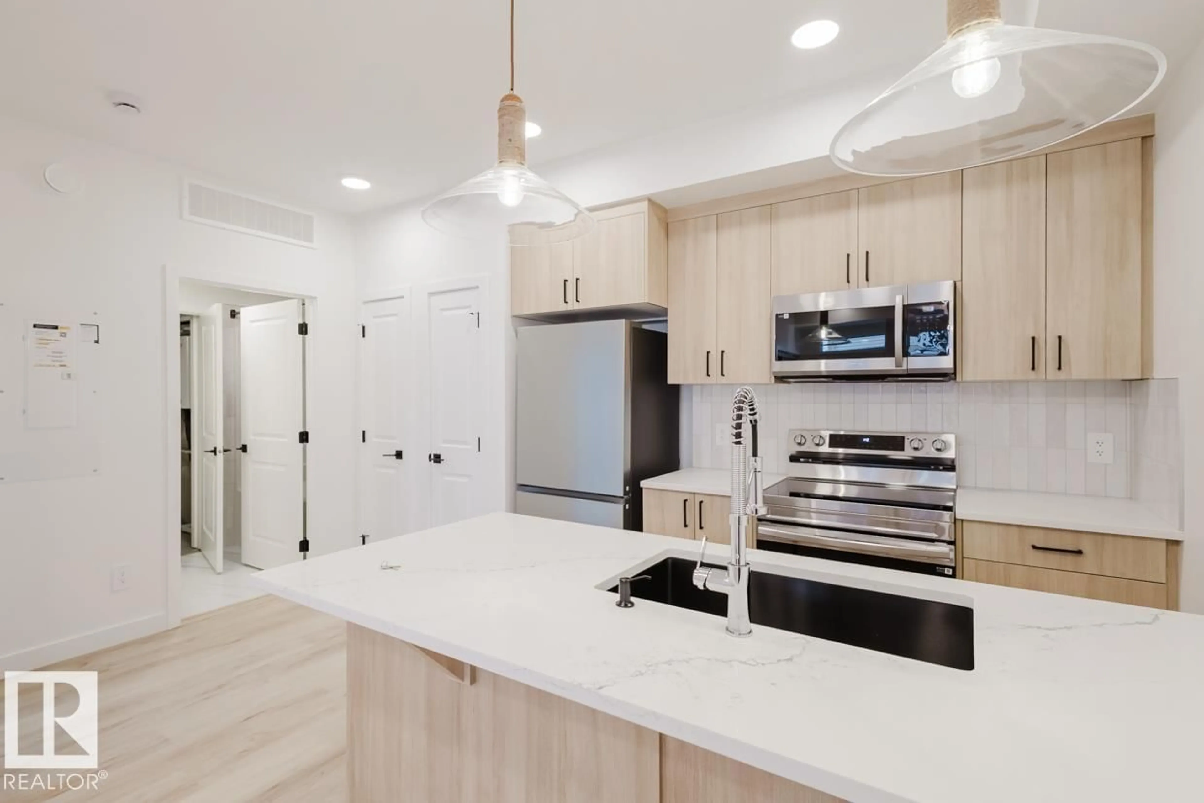 Open concept kitchen, unknown for 19 16231 19 AV SW, Edmonton Alberta T6W5C6