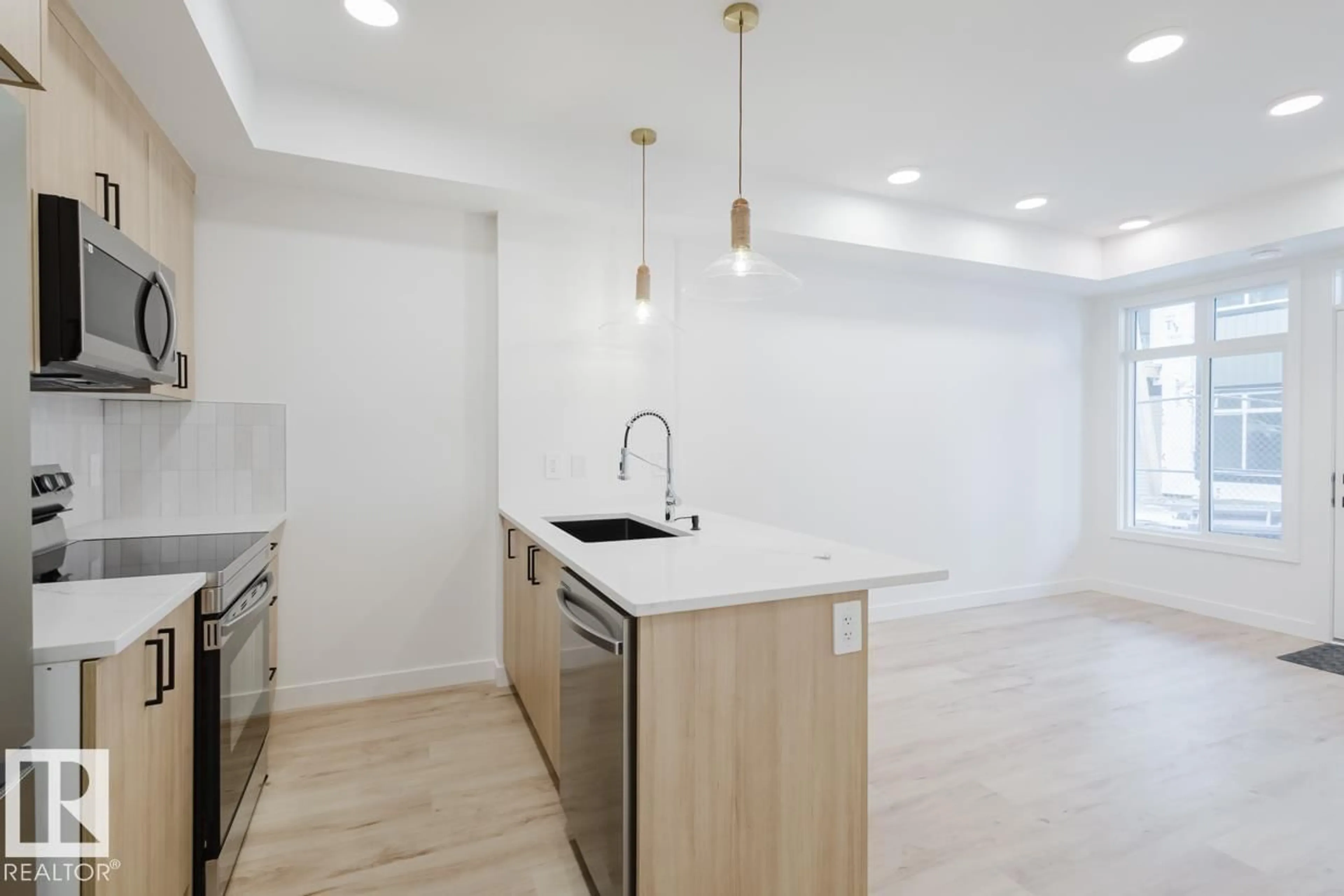 Open concept kitchen, unknown for 19 16231 19 AV SW, Edmonton Alberta T6W5C6