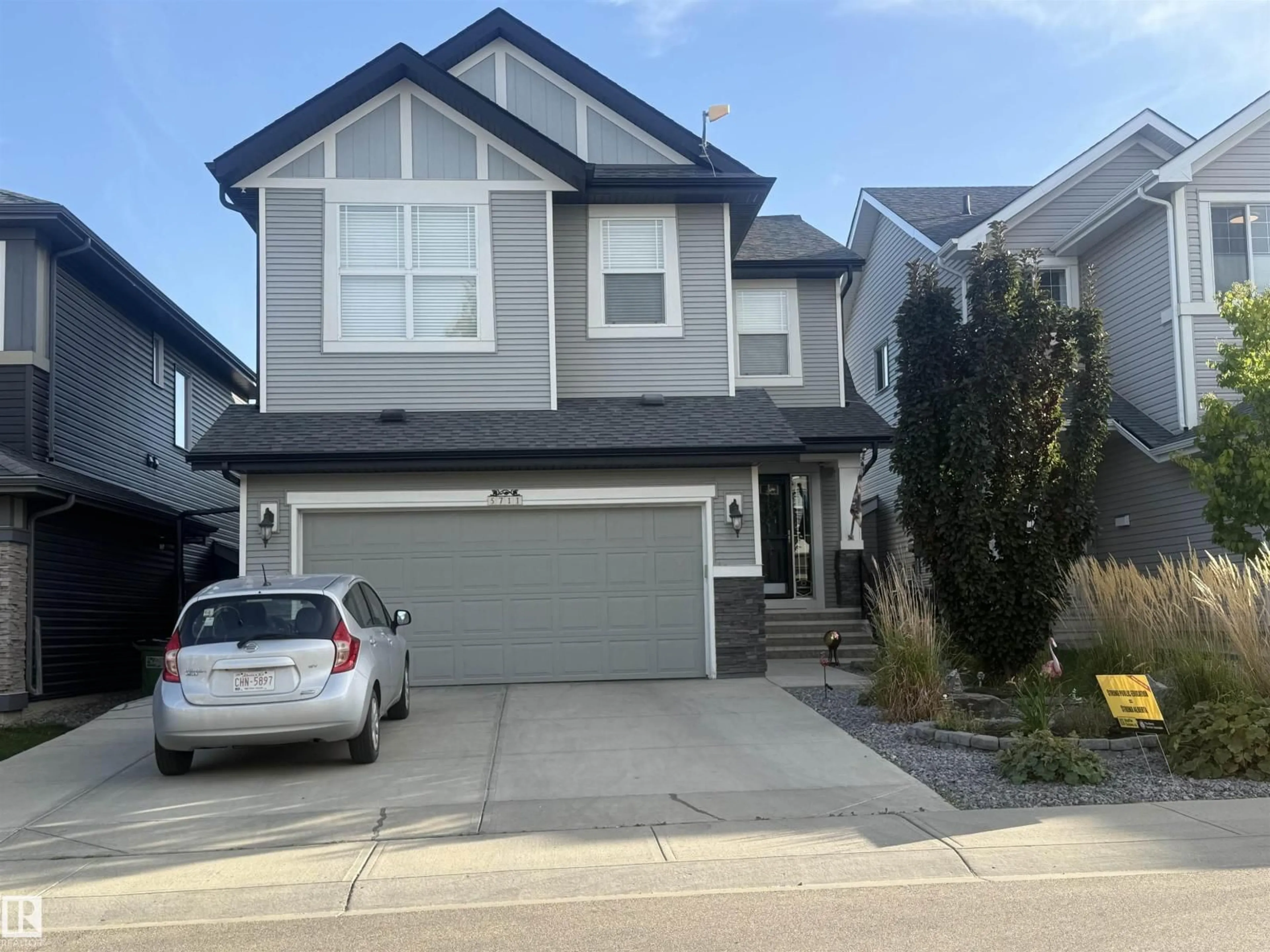 Home with vinyl exterior material, street for 5711 176 AV, Edmonton Alberta T5Y0K7