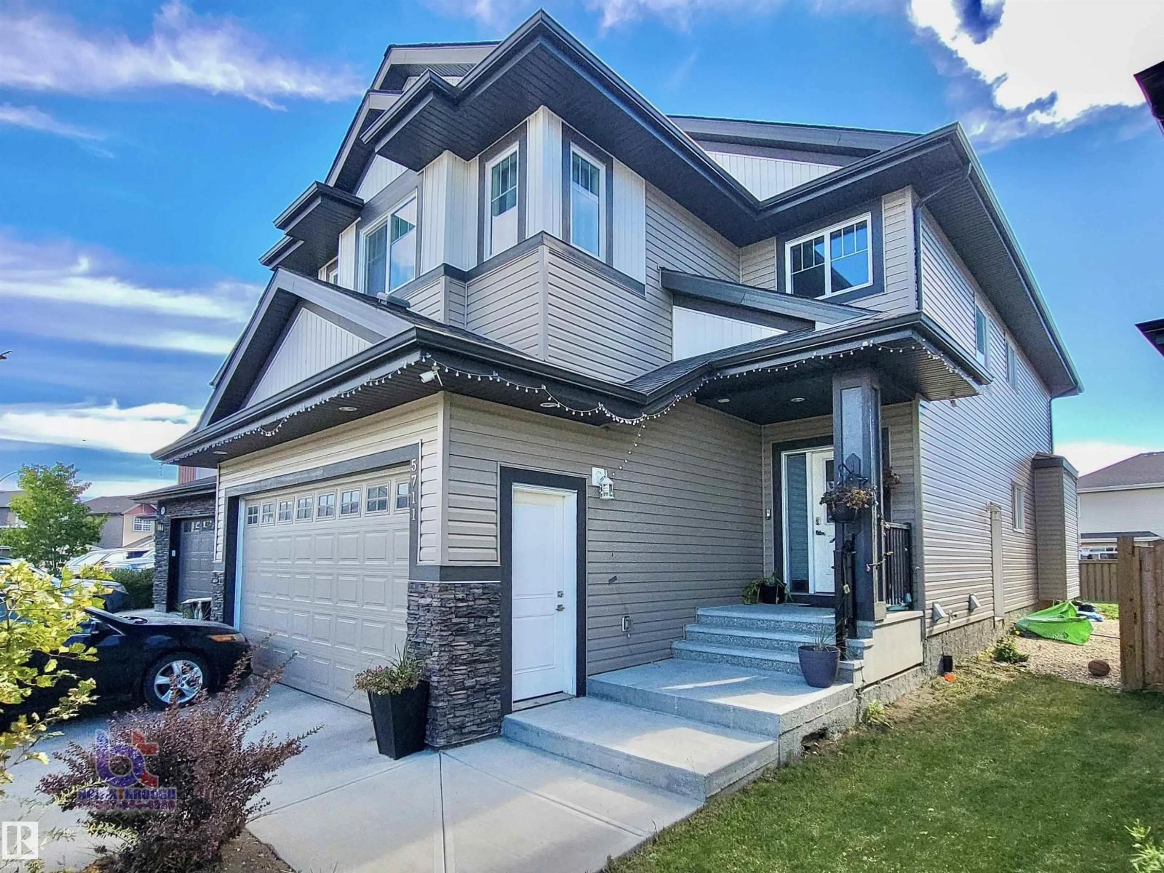 Home with vinyl exterior material, street for 5711 176 AV, Edmonton Alberta T5Y0K7