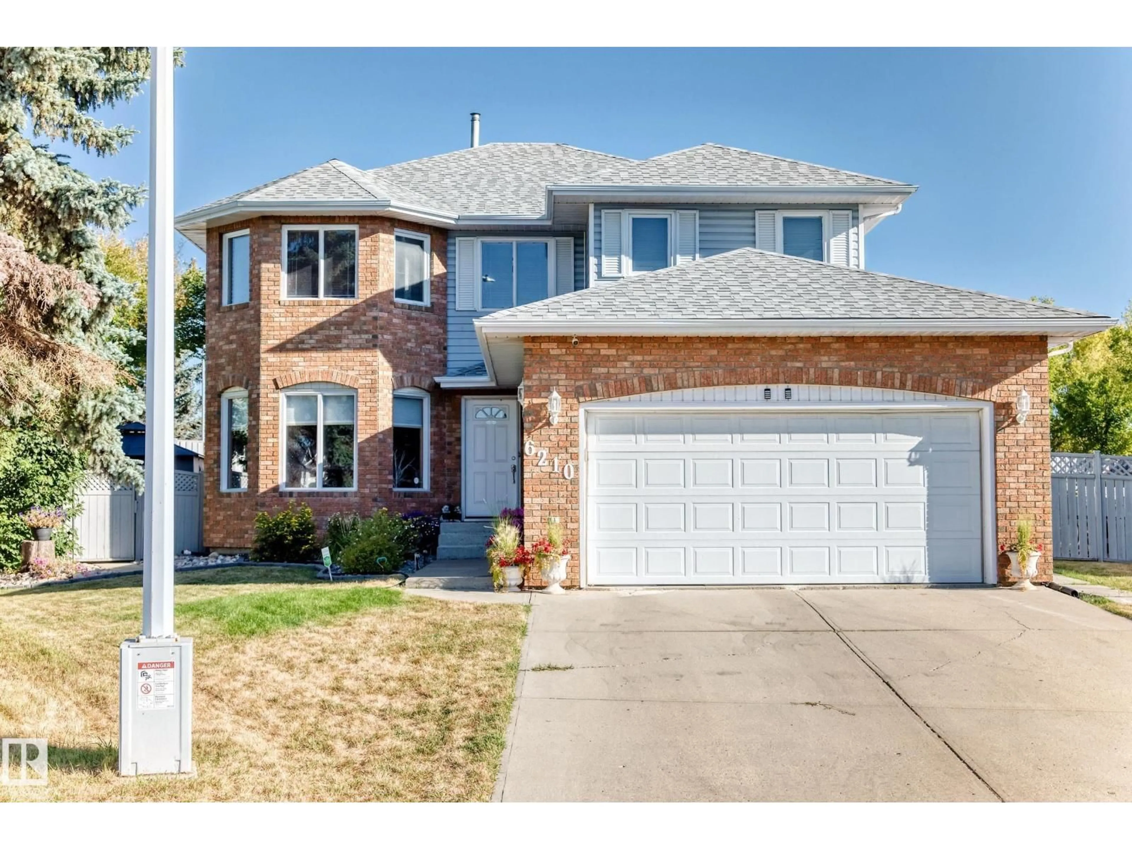 Home with brick exterior material, street for NW - 6210 152C AV, Edmonton Alberta T5A4W6