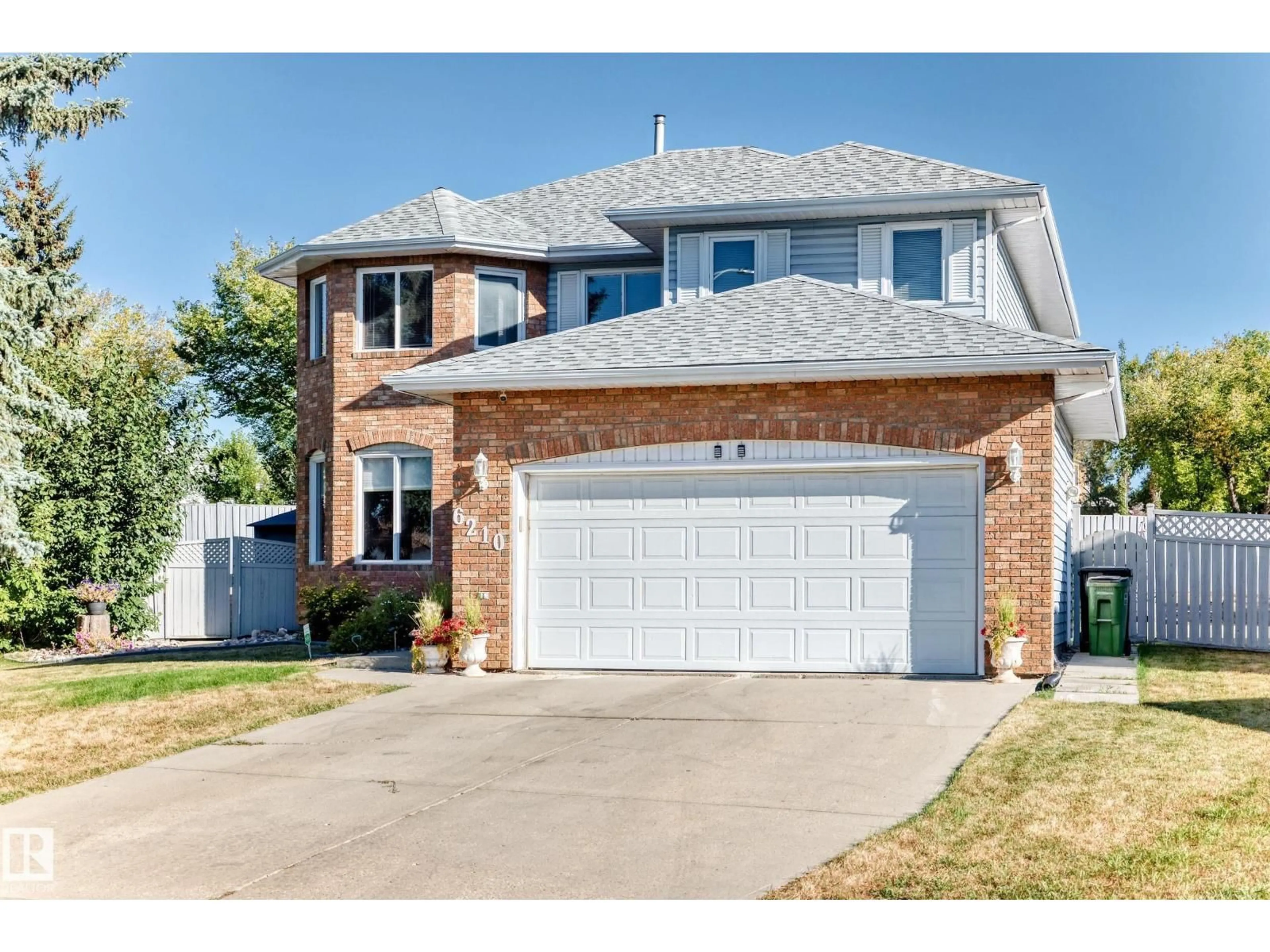 Home with brick exterior material, street for NW - 6210 152C AV, Edmonton Alberta T5A4W6