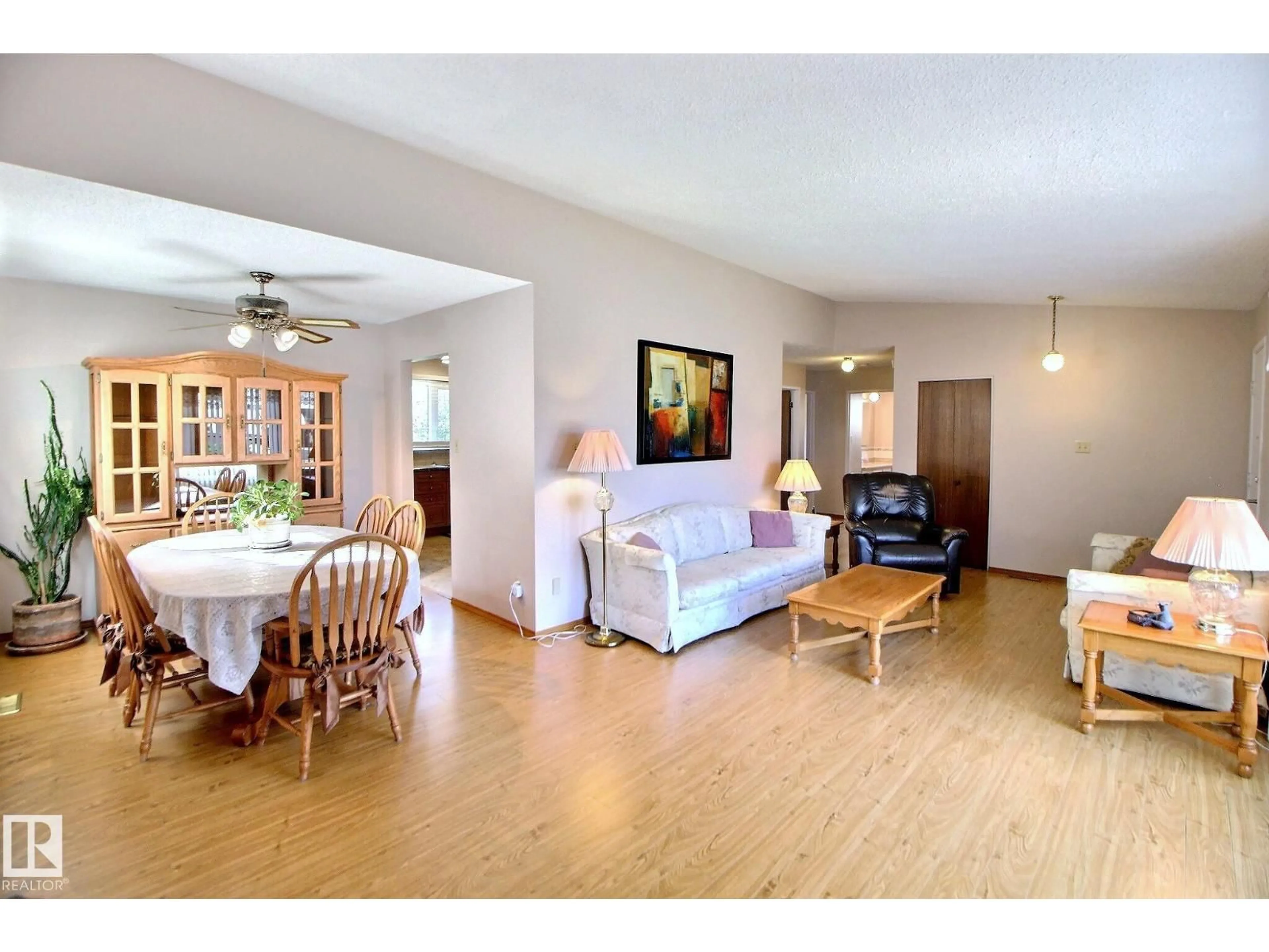 Living room with furniture, wood/laminate floor for NW - 15208 58 ST, Edmonton Alberta T5A2M2