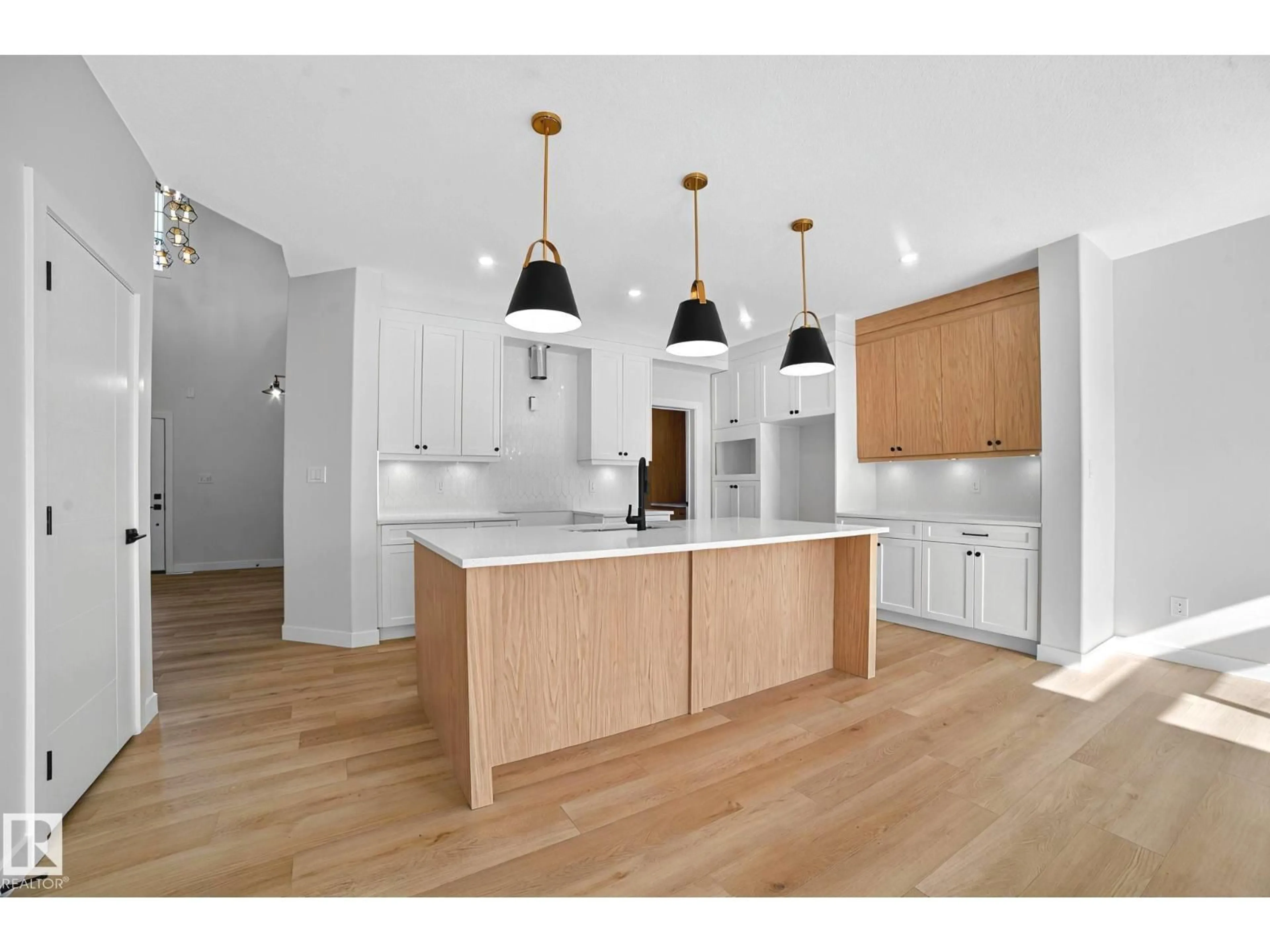 Open concept kitchen, wood/laminate floor for 142 LARCH CRESCENT, Leduc Alberta T9E0S5
