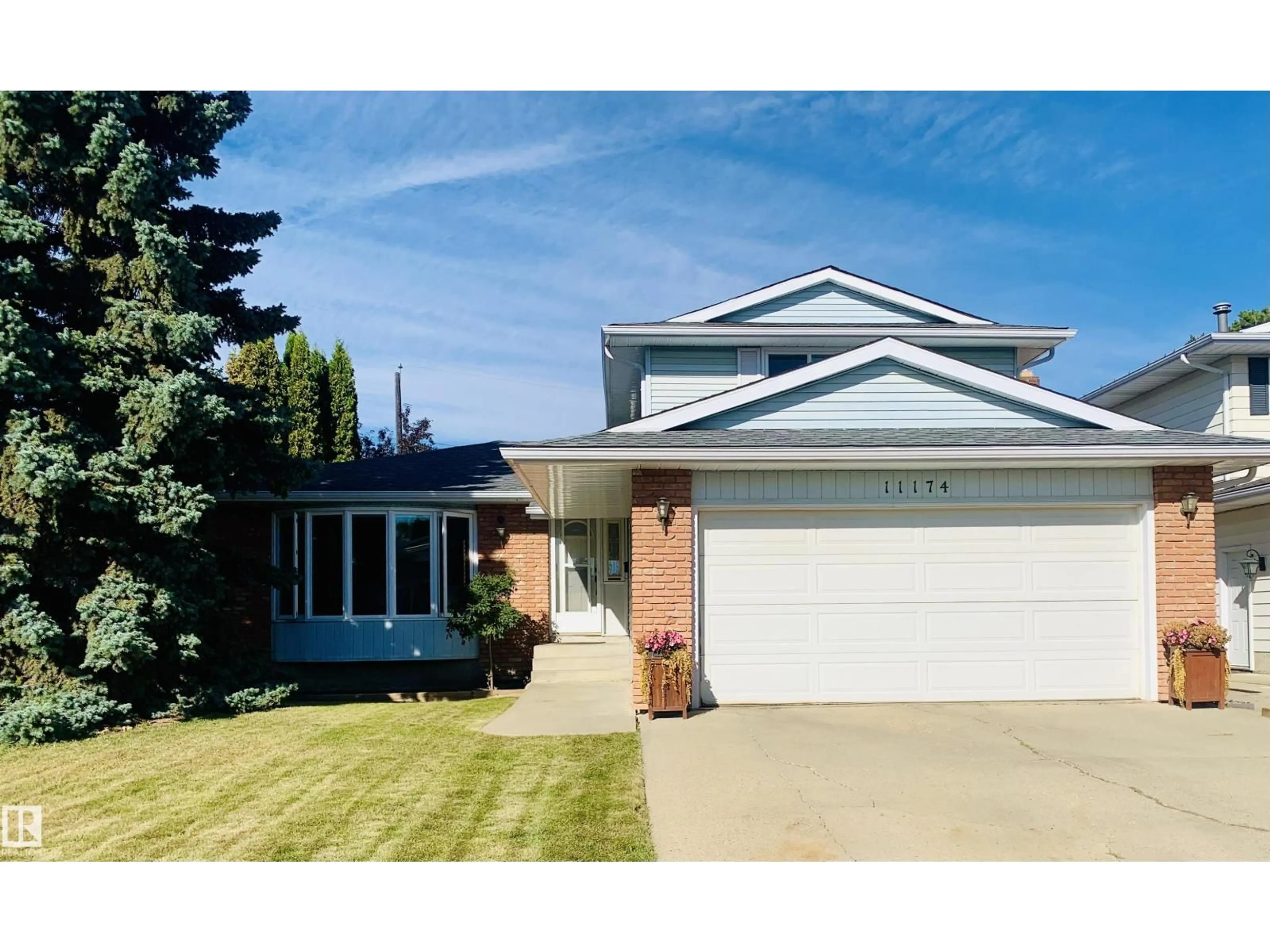 Home with vinyl exterior material, street for 11174 35 AV, Edmonton Alberta T6J3N1