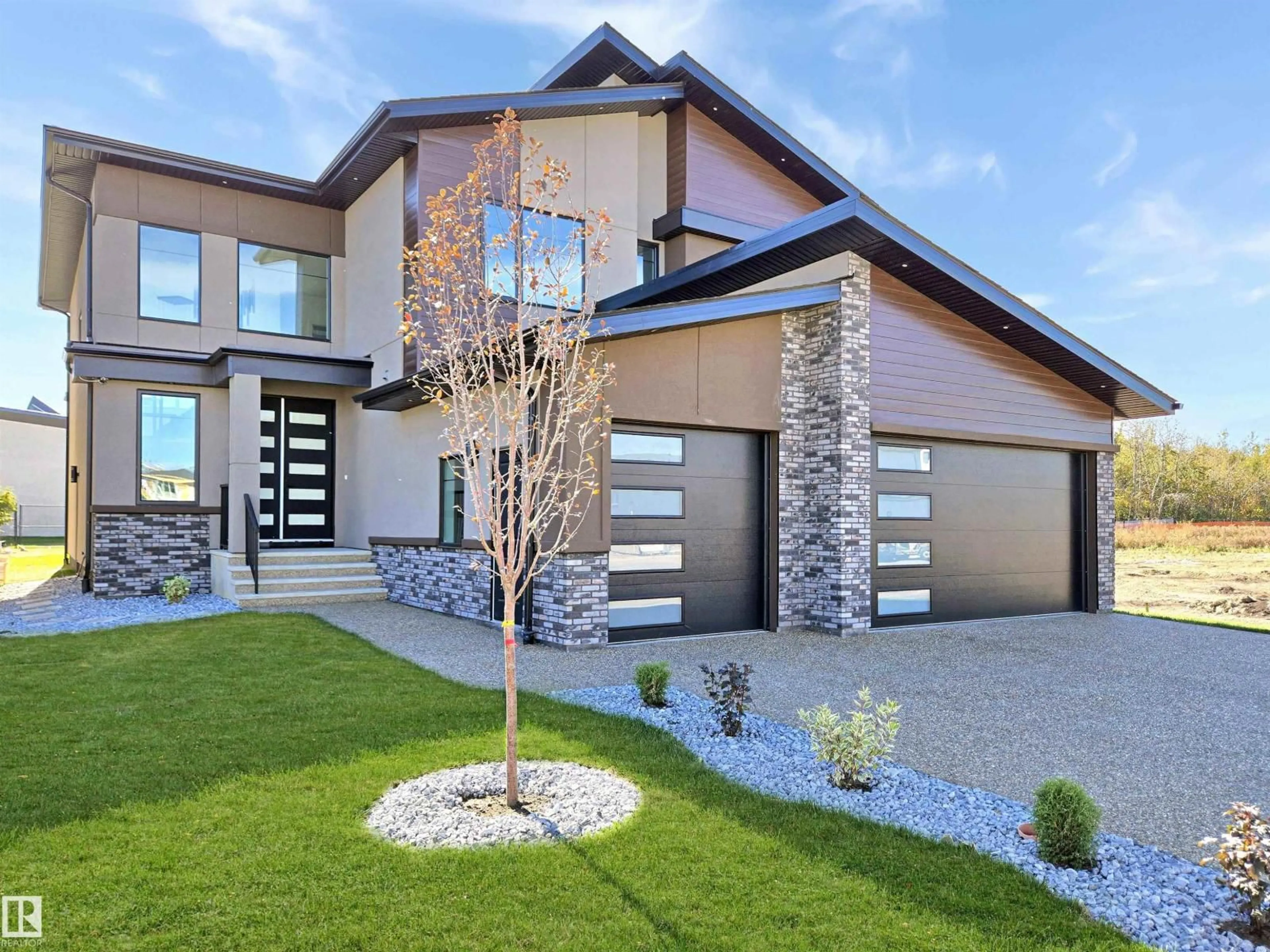 Home with brick exterior material, street for NE - 715 165 AV, Edmonton Alberta T5Y4J1