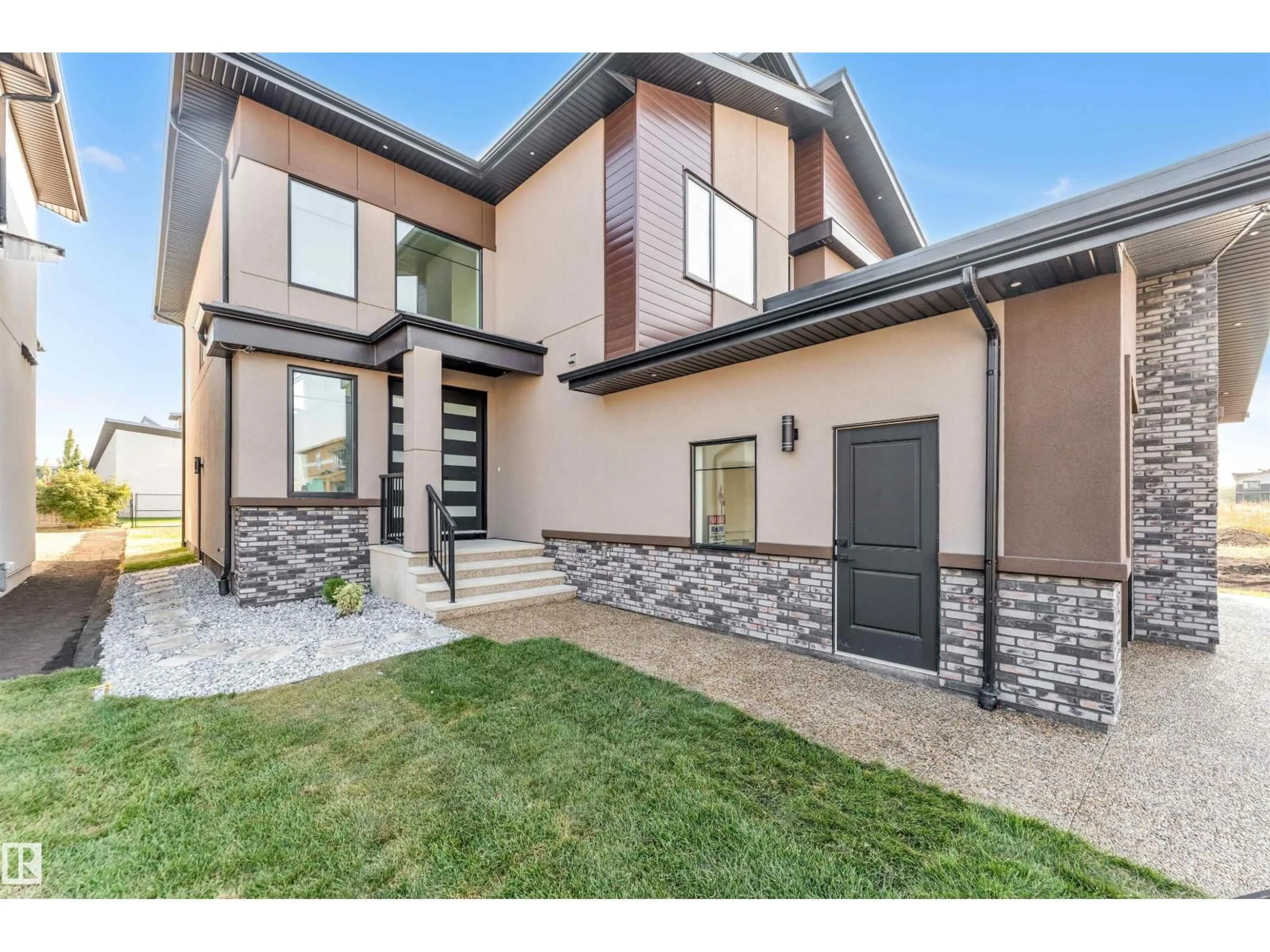 Home with brick exterior material, street for NE - 715 165 AV, Edmonton Alberta T5Y4J1