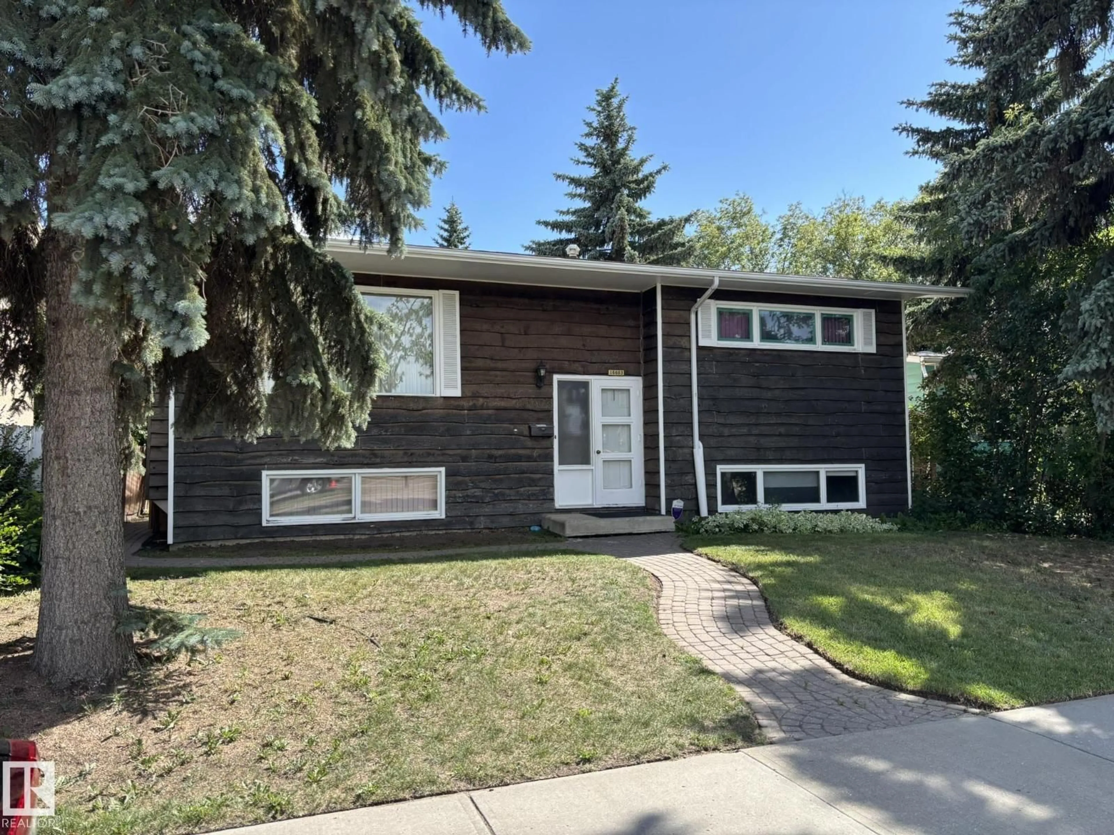 Home with vinyl exterior material, street for 16603 95 AV, Edmonton Alberta T5P0B1