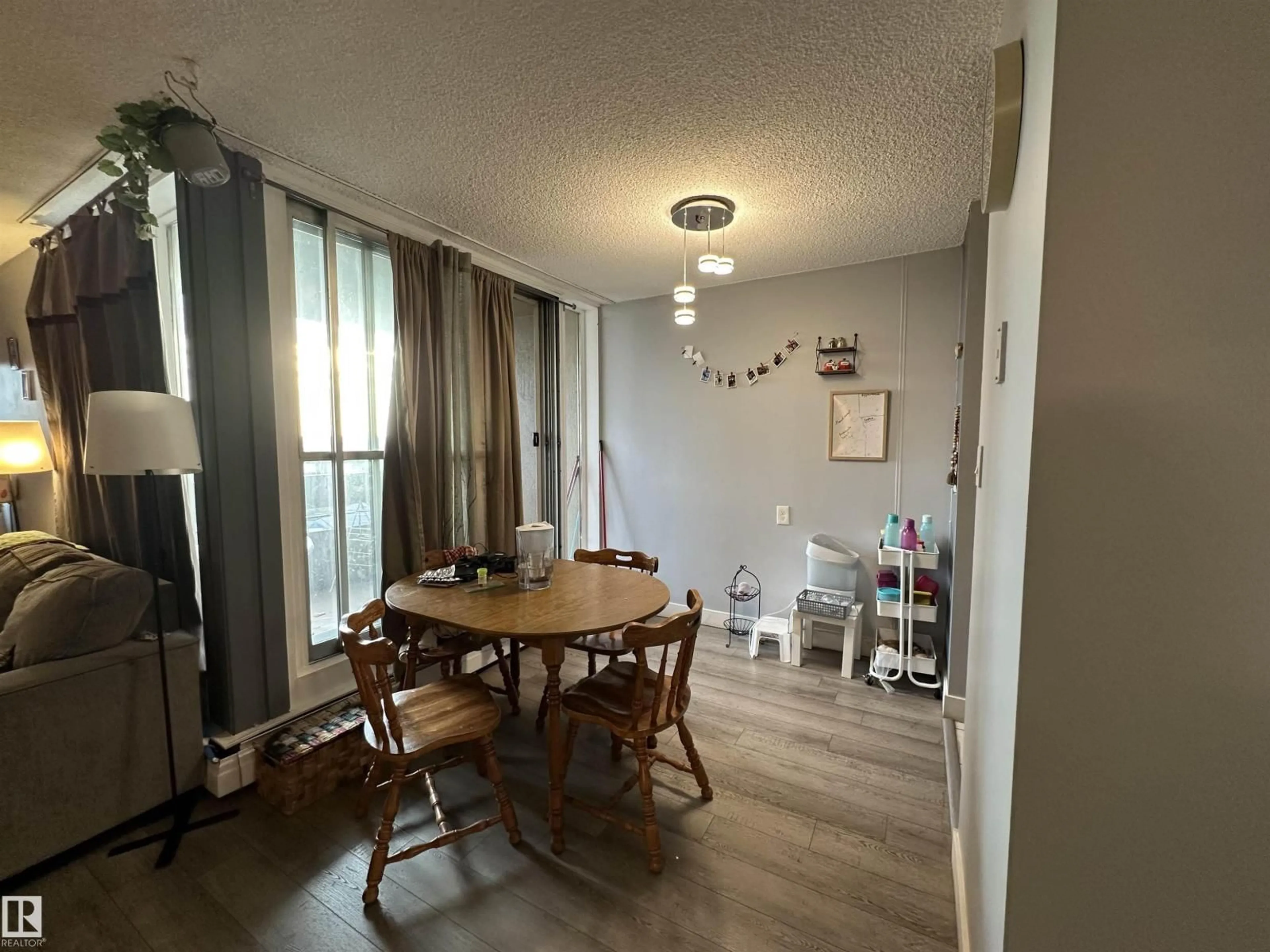 Dining room, wood/laminate floor for #75 - 8735 165 ST, Edmonton Alberta T5R2R6