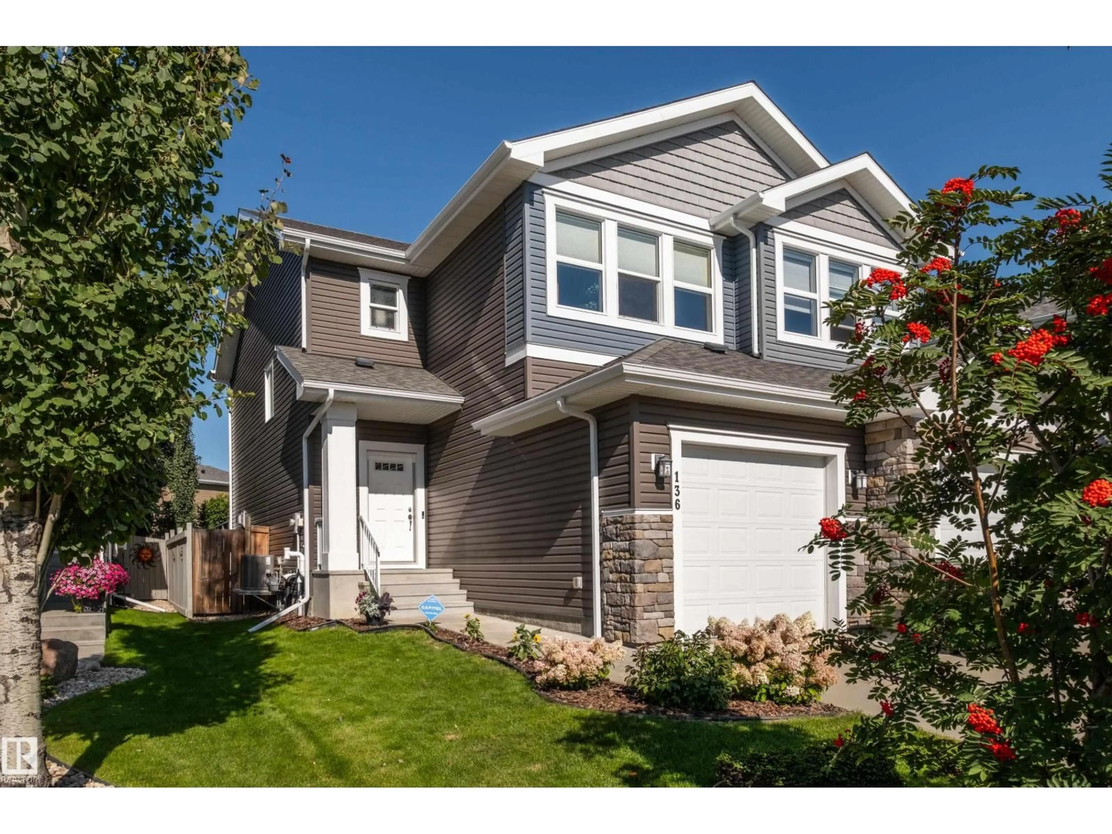 Home with vinyl exterior material, street for 136 REED PL, Leduc Alberta T9E1B1