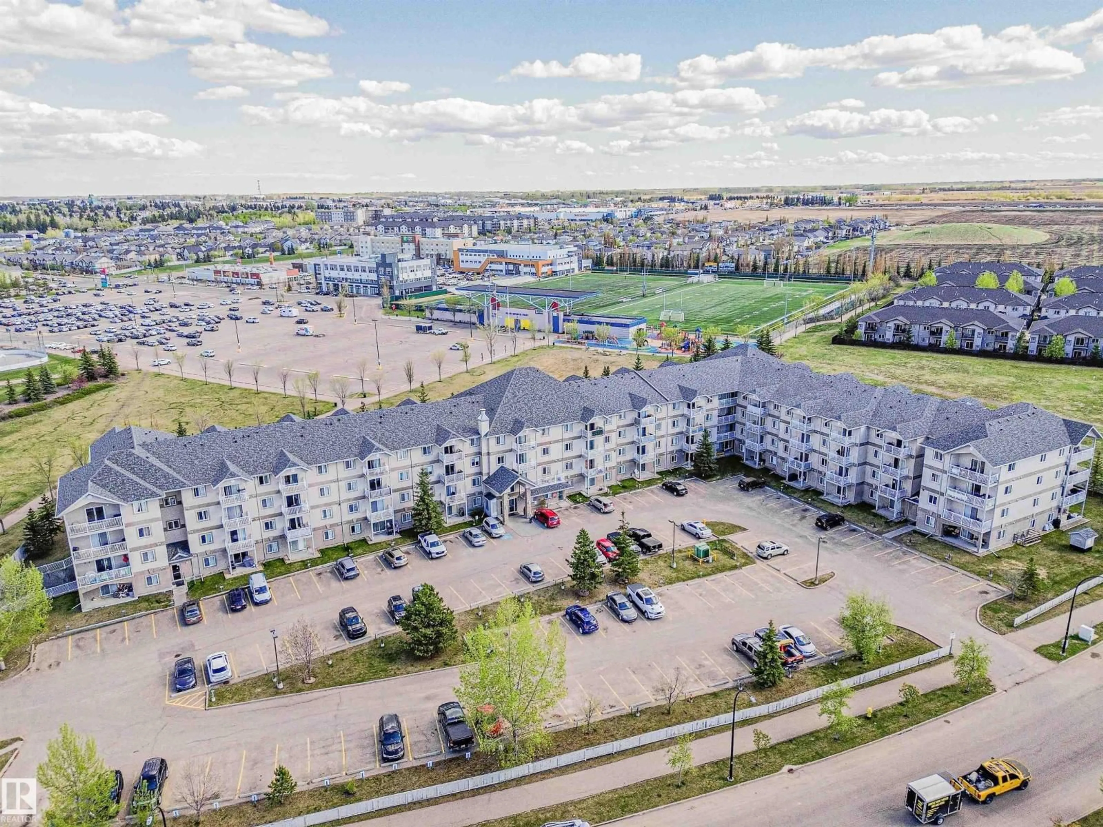 A pic from outside/outdoor area/front of a property/back of a property/a pic from drone, unknown for 208 - 240 SPRUCE RIDGE RD, Spruce Grove Alberta T7X0G5