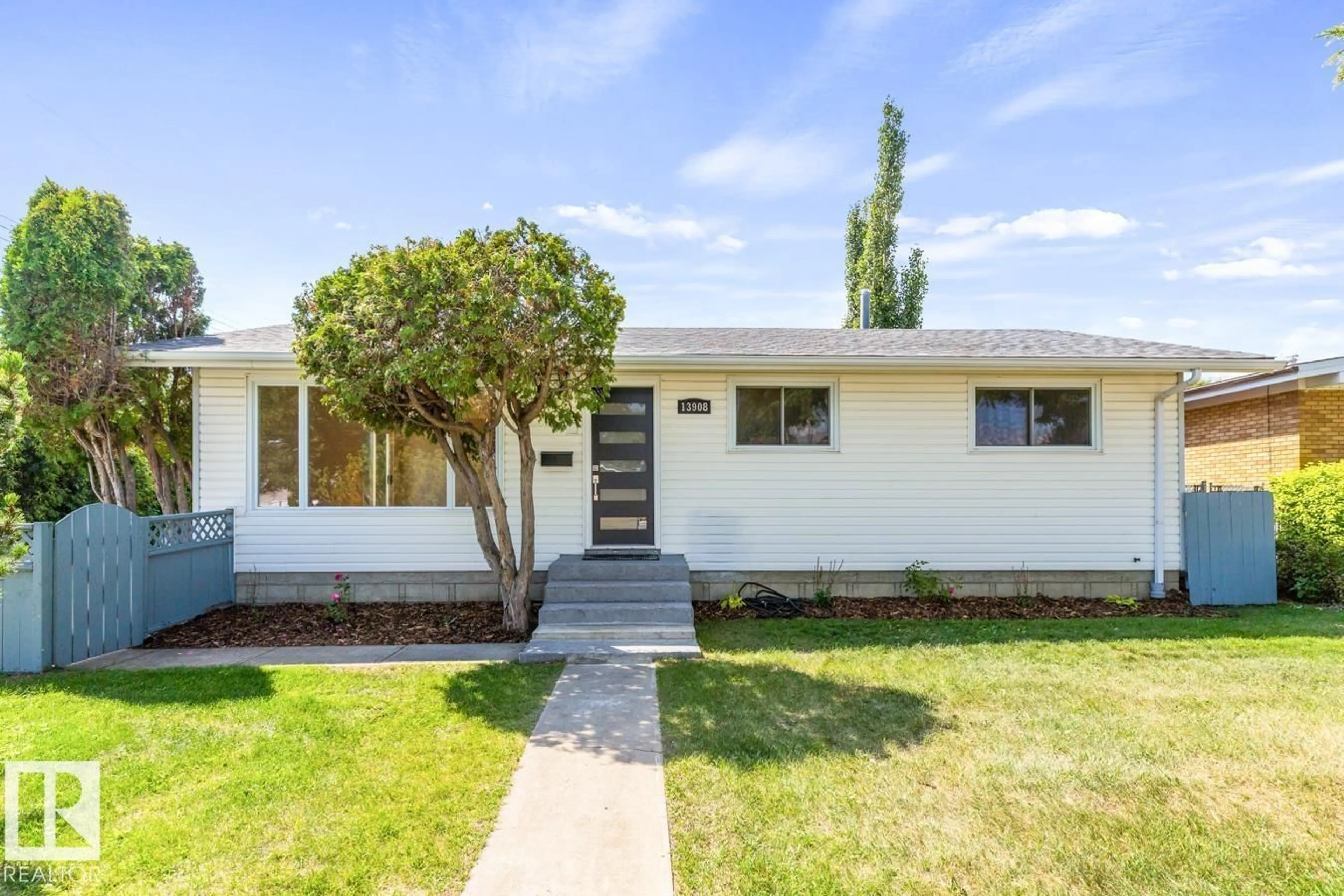 Home with vinyl exterior material, street for NW - 13908 57 ST, Edmonton Alberta T5A1M6
