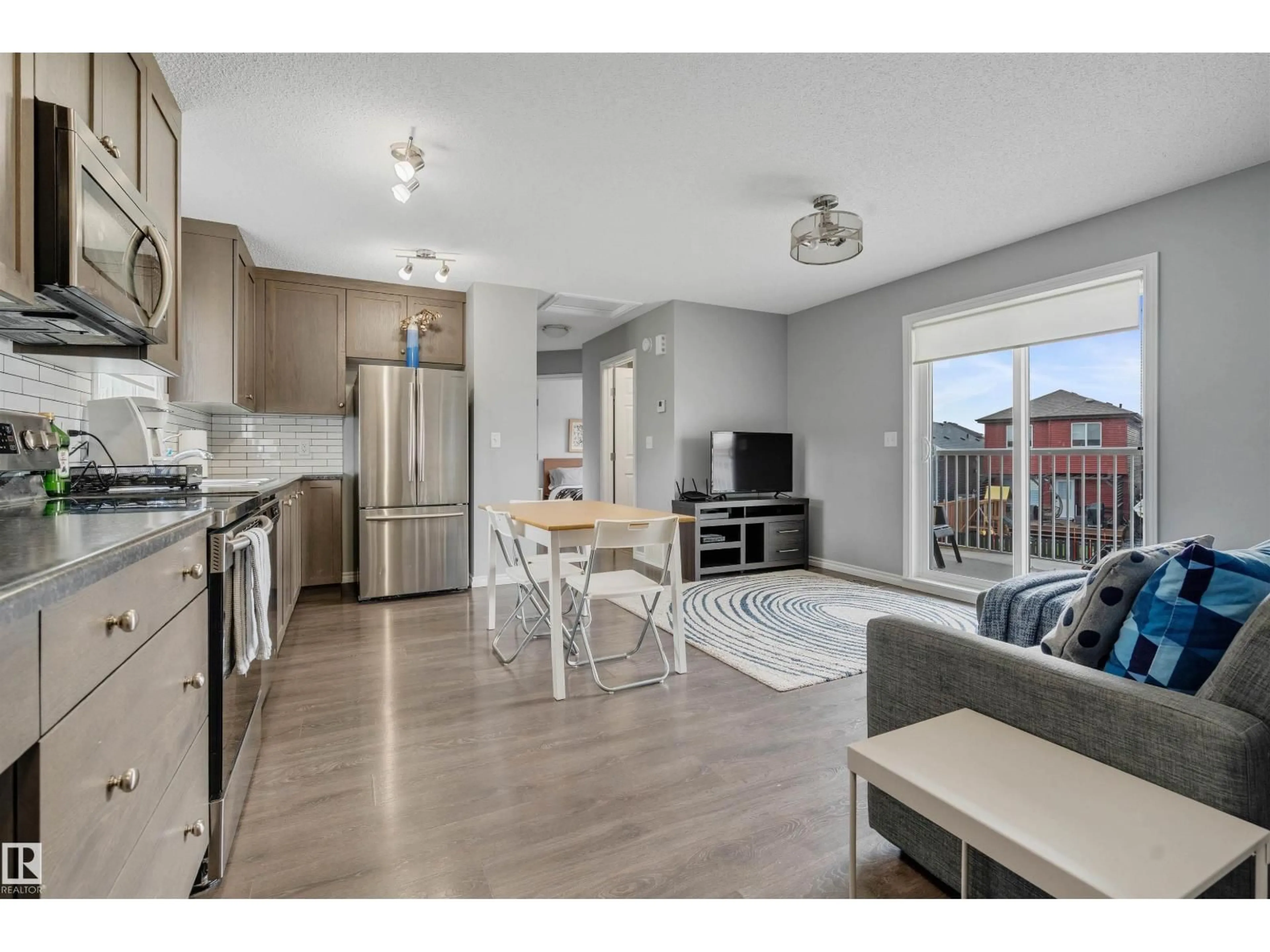 Open concept kitchen, wood/laminate floor for 8616 221 ST, Edmonton Alberta T5T7H7