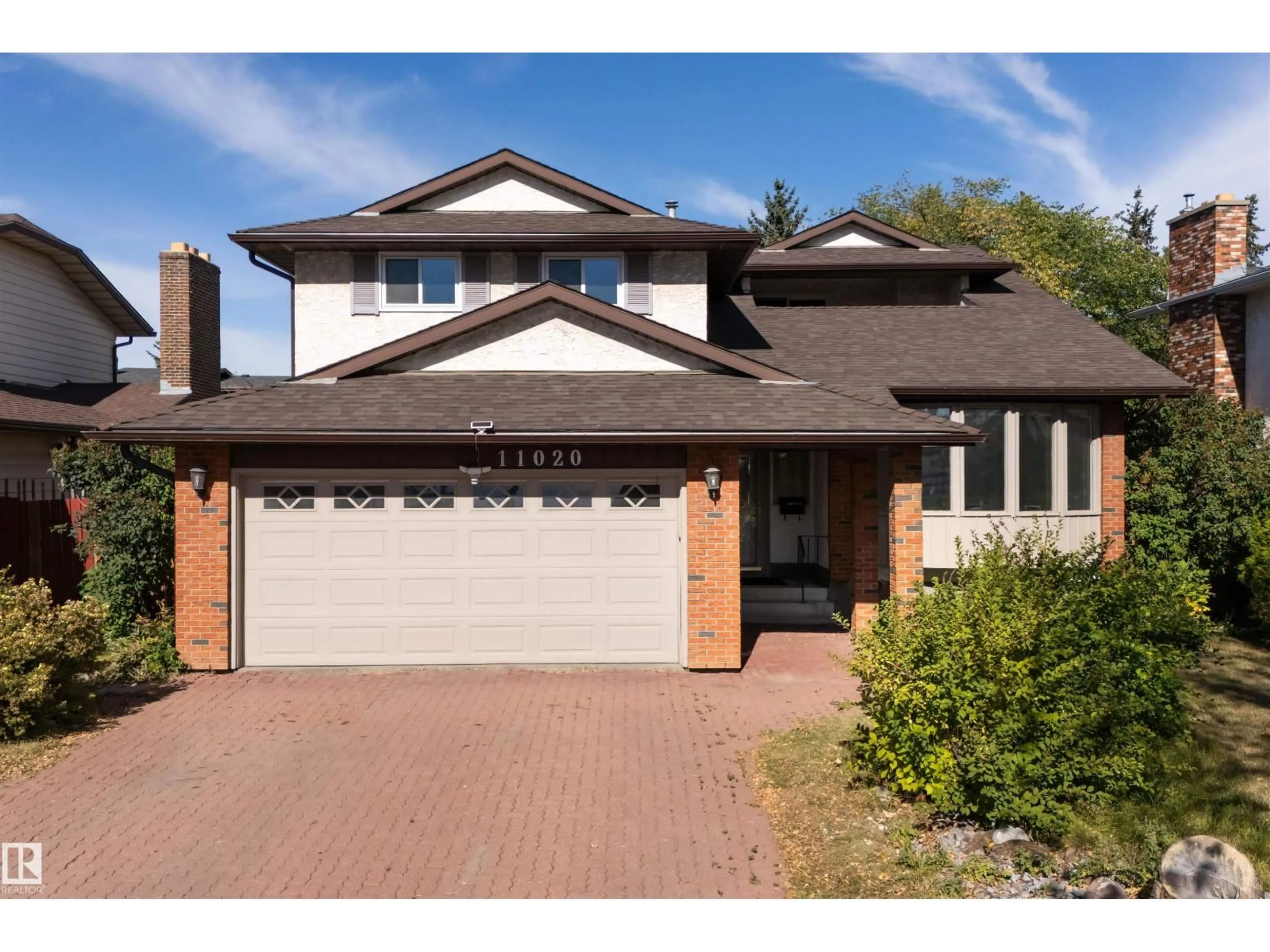 Home with brick exterior material, street for 11020 158 AV, Edmonton Alberta T5X4V4