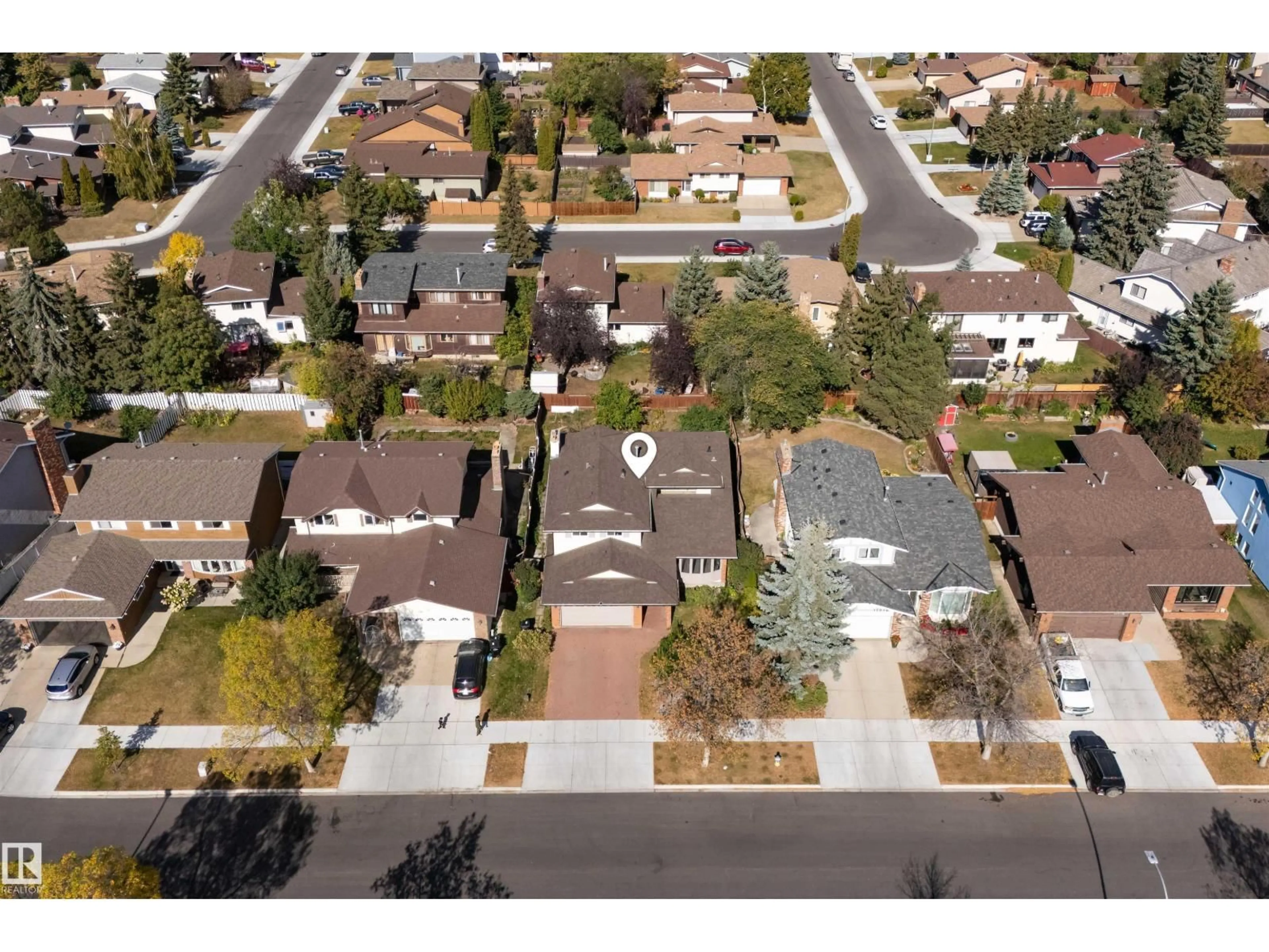 A pic from outside/outdoor area/front of a property/back of a property/a pic from drone, street for 11020 158 AV, Edmonton Alberta T5X4V4