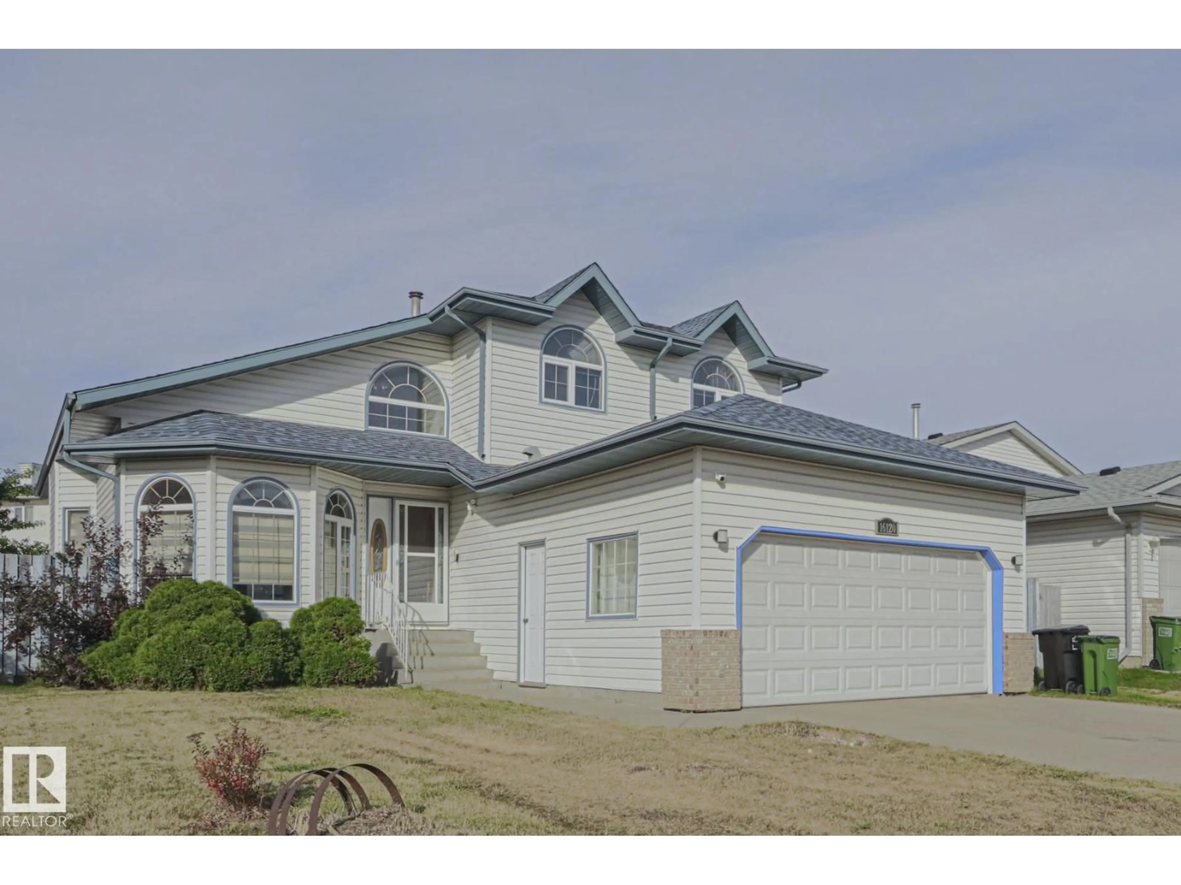 Home with vinyl exterior material, street for 16120 57A ST NW, Edmonton Alberta T5Y2T1