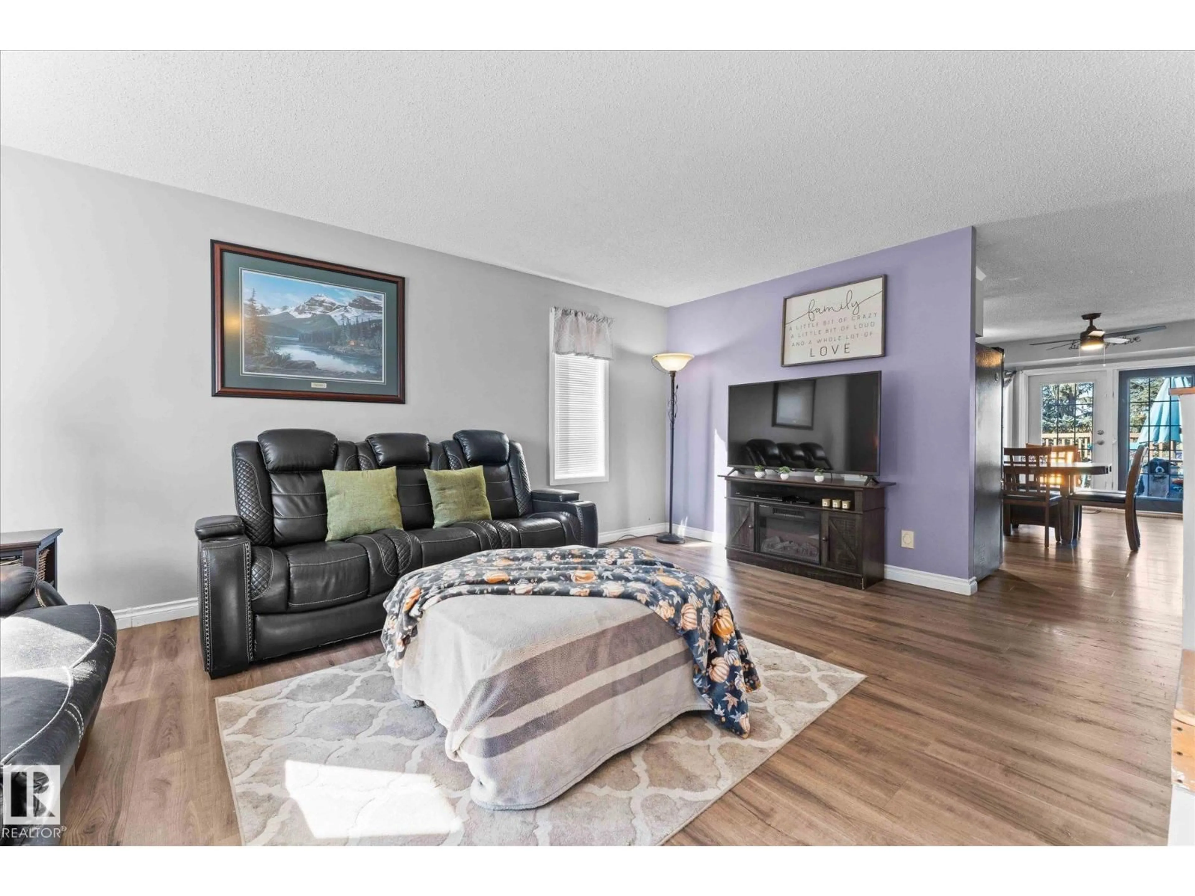 Living room with furniture, wood/laminate floor for 135 ST. ANDREWS DR, Stony Plain Alberta T7Z1K7