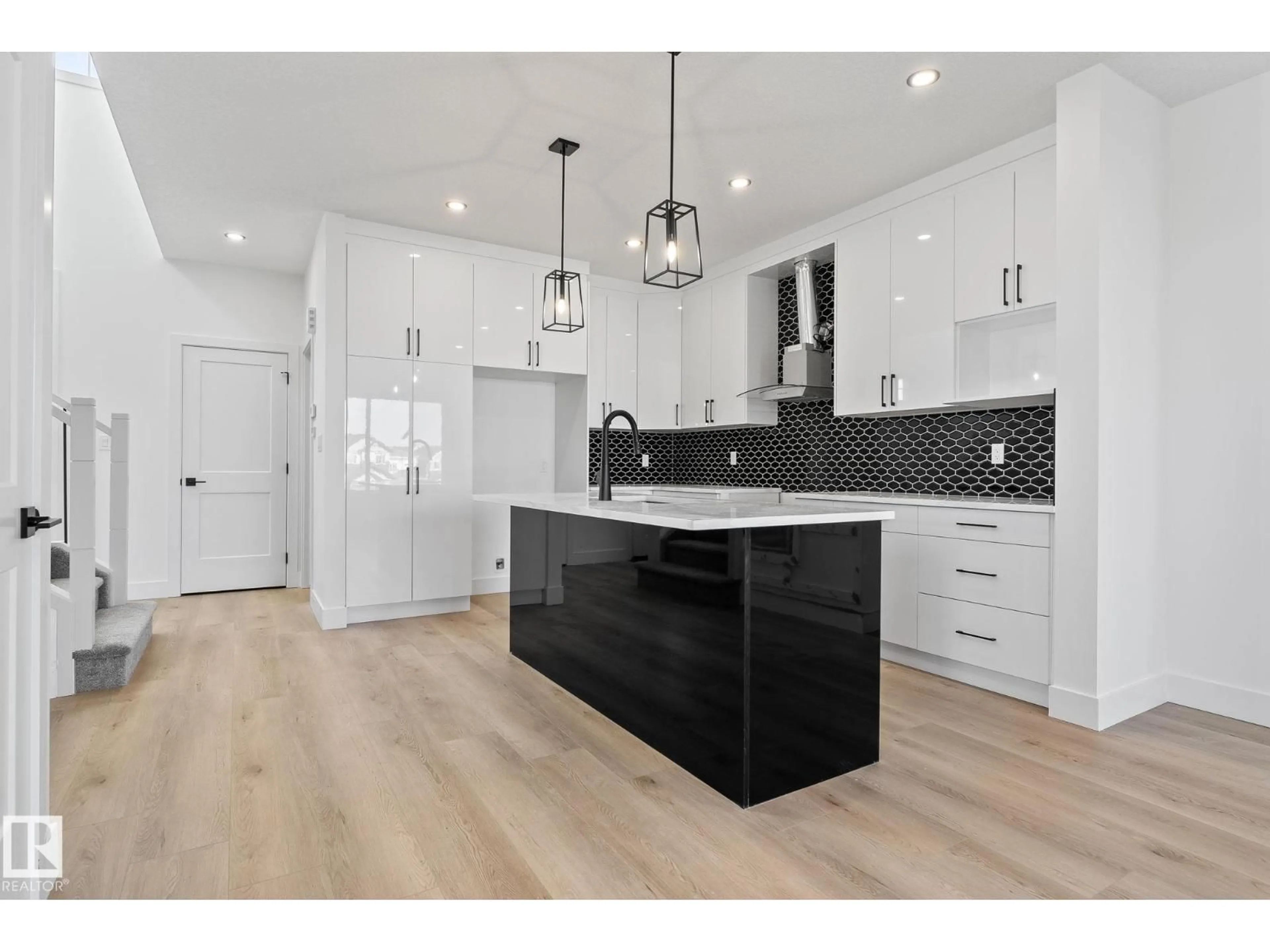 Open concept kitchen, wood/laminate floor for 326 32 AV, Edmonton Alberta T6T2K2