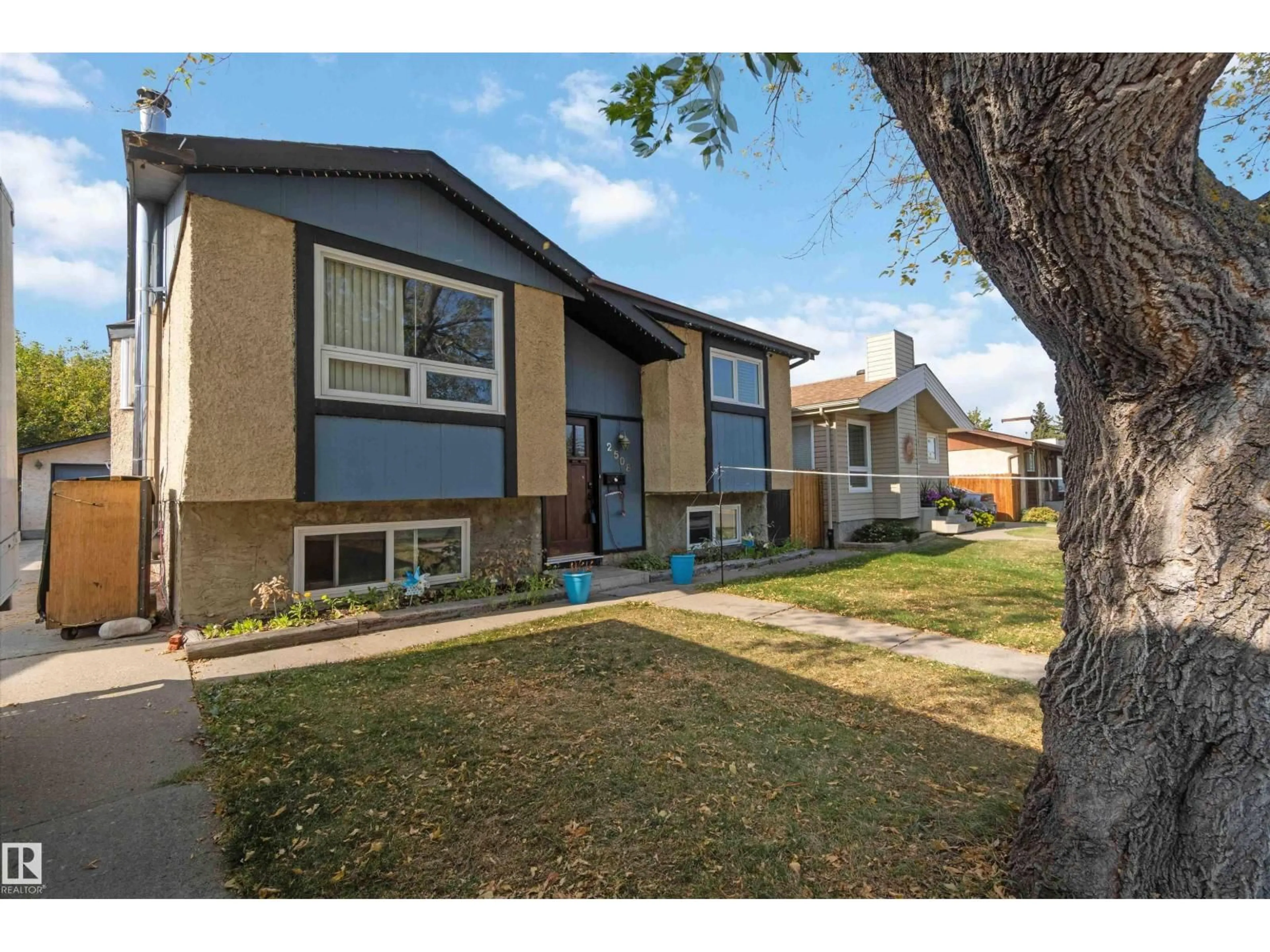 Home with vinyl exterior material, street for 2508 49 ST, Edmonton Alberta T6L3W9