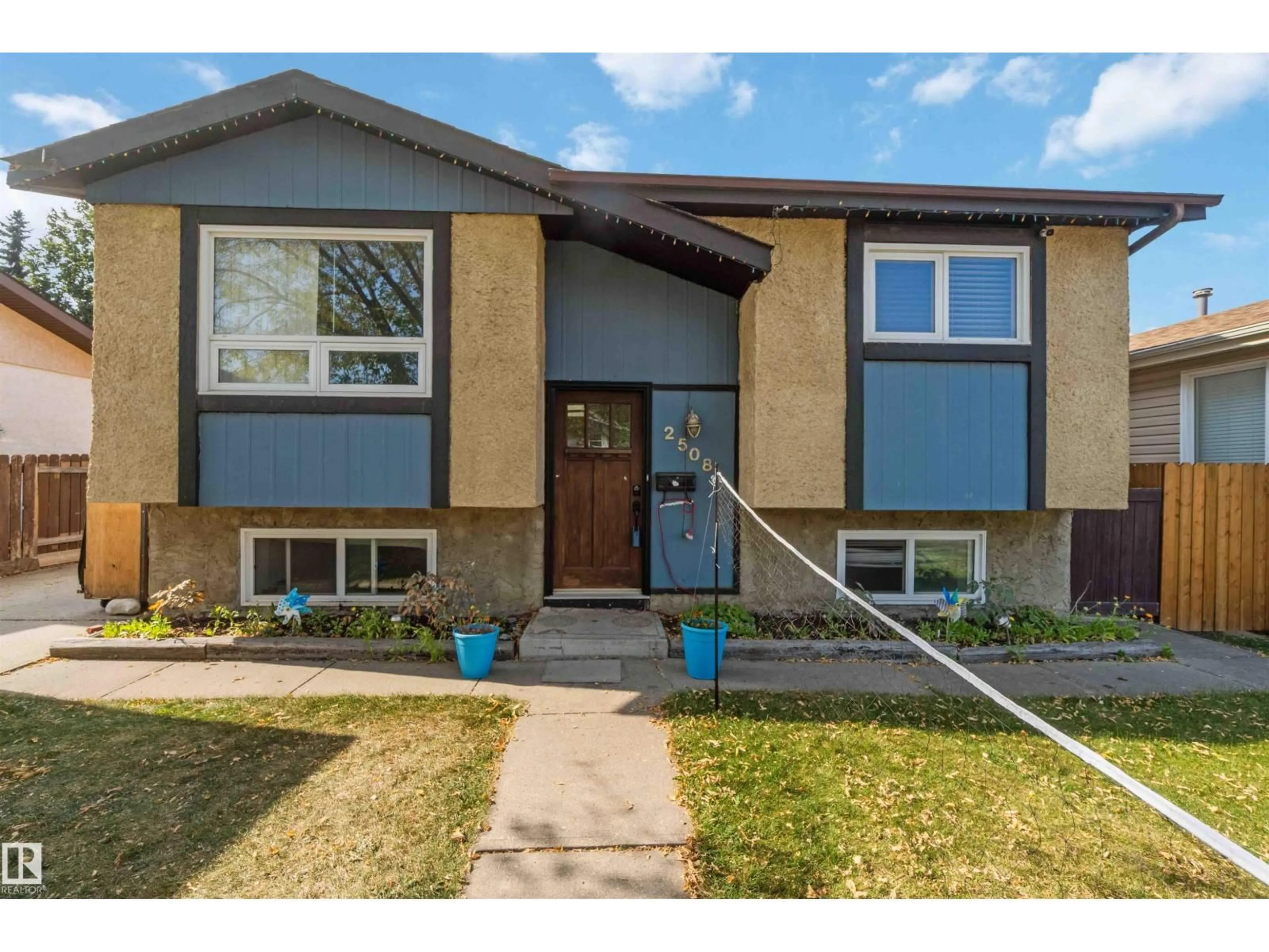 Home with vinyl exterior material, street for 2508 49 ST, Edmonton Alberta T6L3W9