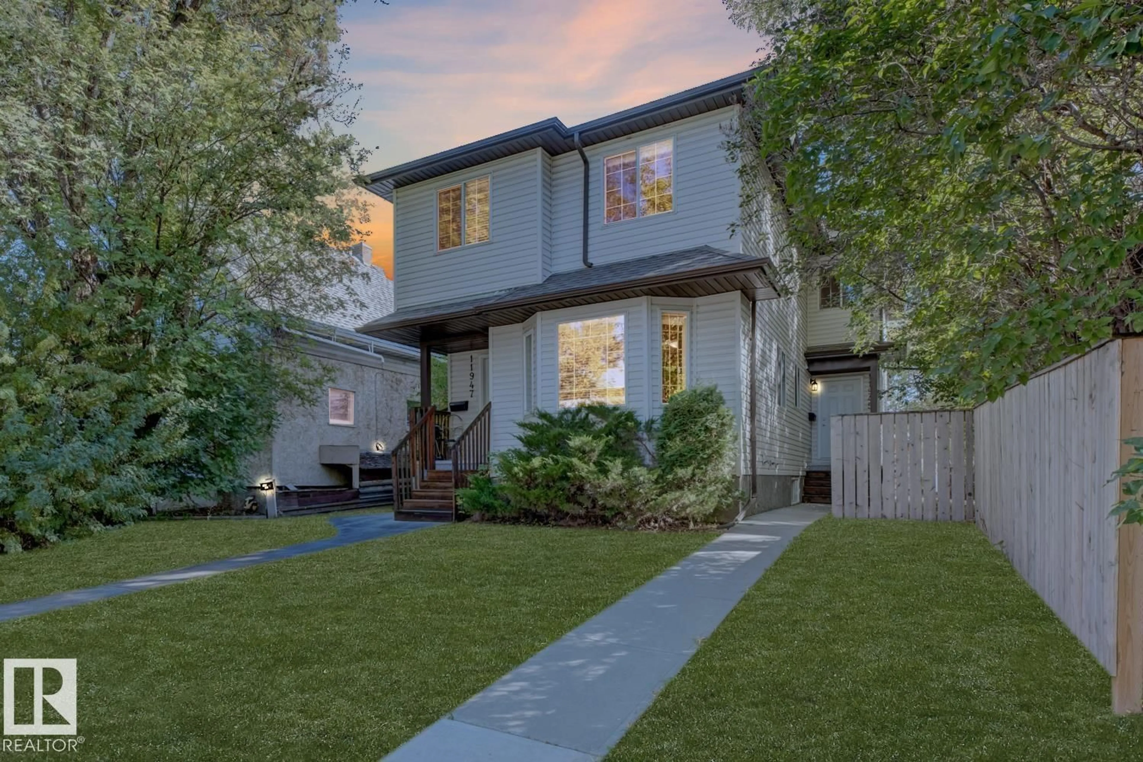 Home with vinyl exterior material, street for 11945 80 ST, Edmonton Alberta T5B2N8