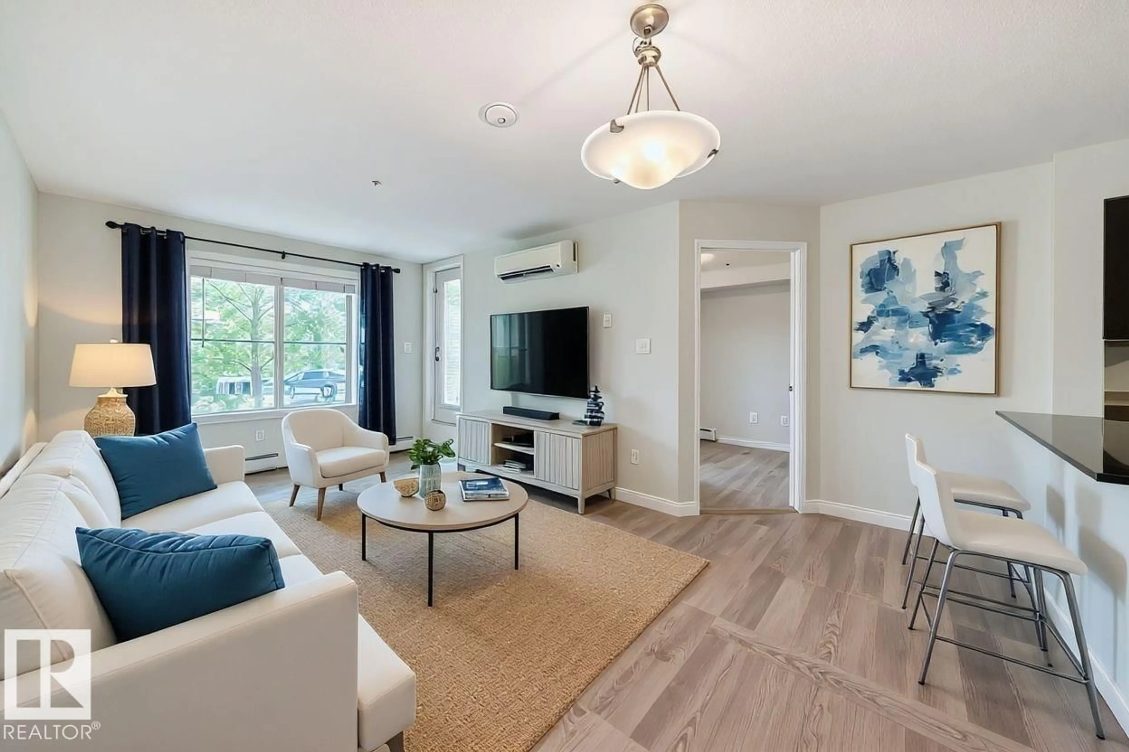 Living room with furniture, unknown for #123 - 270 MCCONACHIE DR, Edmonton Alberta T5Y3N4