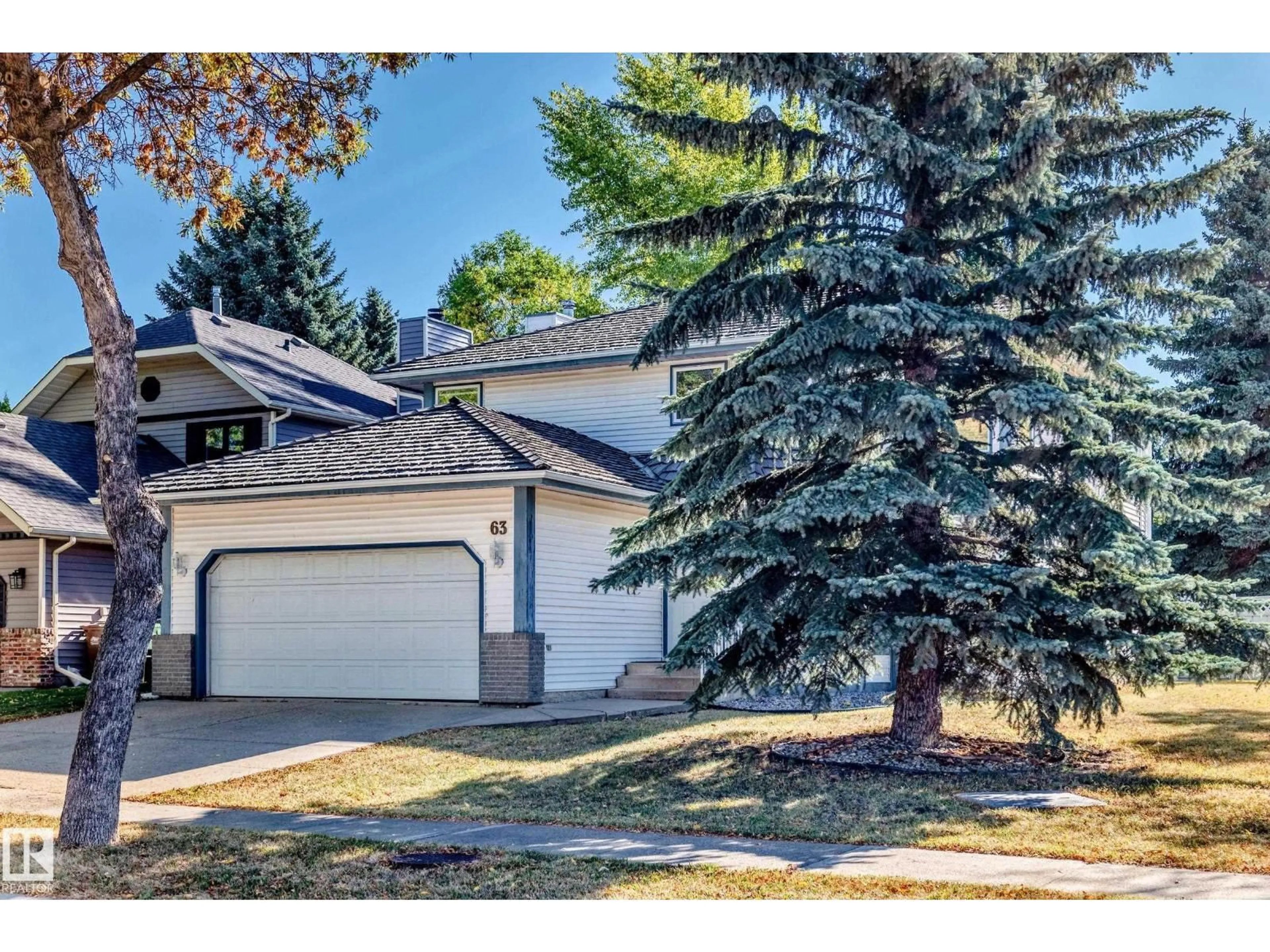 Home with vinyl exterior material, street for 63 PIEDMONT CR, St. Albert Alberta T8N5G2