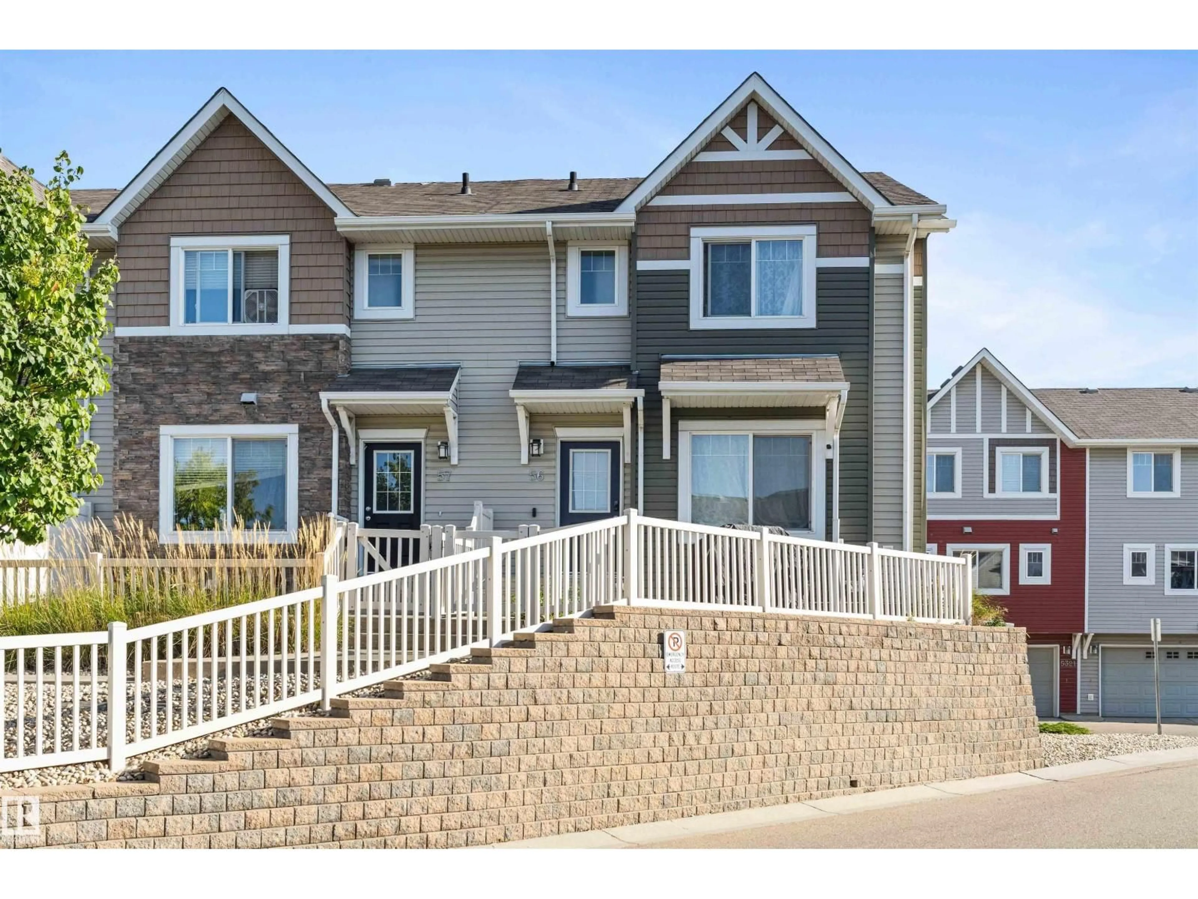 Home with vinyl exterior material, street for 56 5317 3 AV SW, Edmonton Alberta T6X0W7