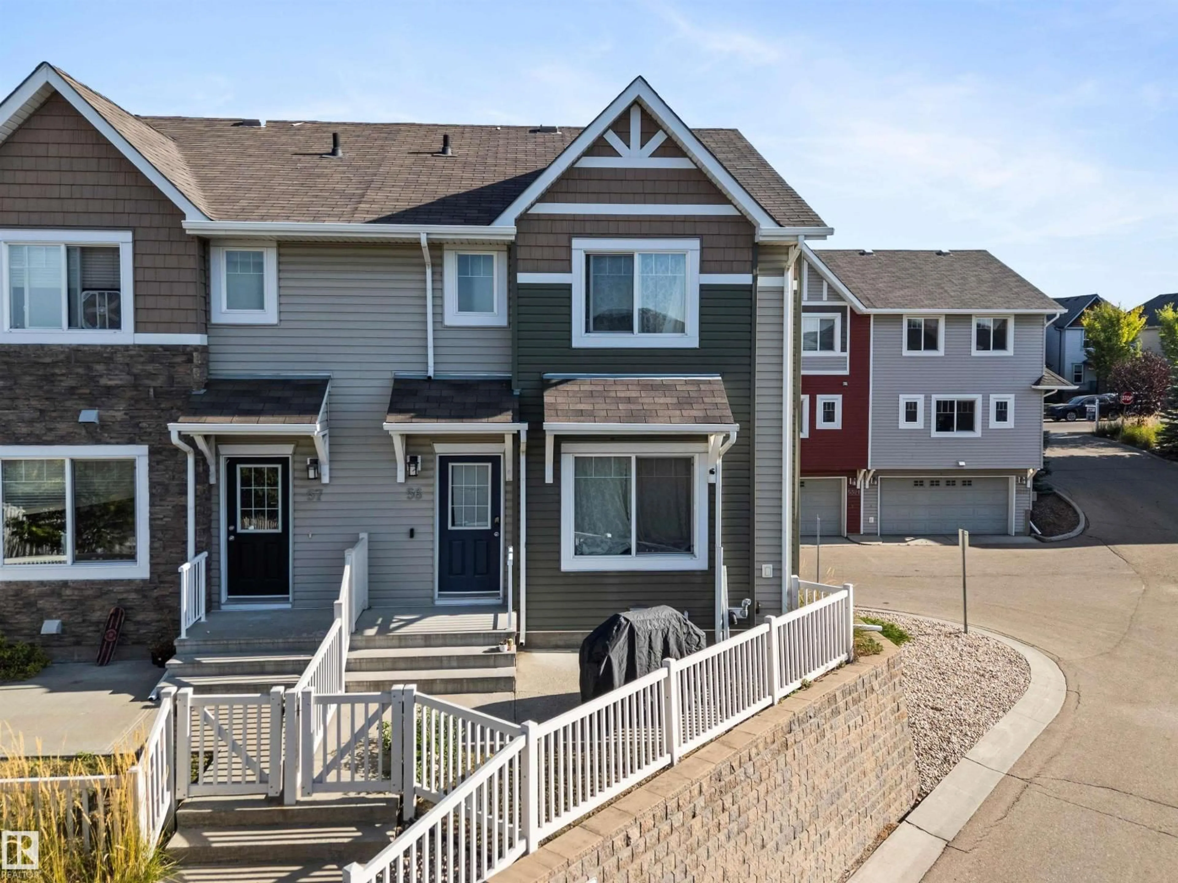 Home with vinyl exterior material, street for 56 5317 3 AV SW, Edmonton Alberta T6X0W7