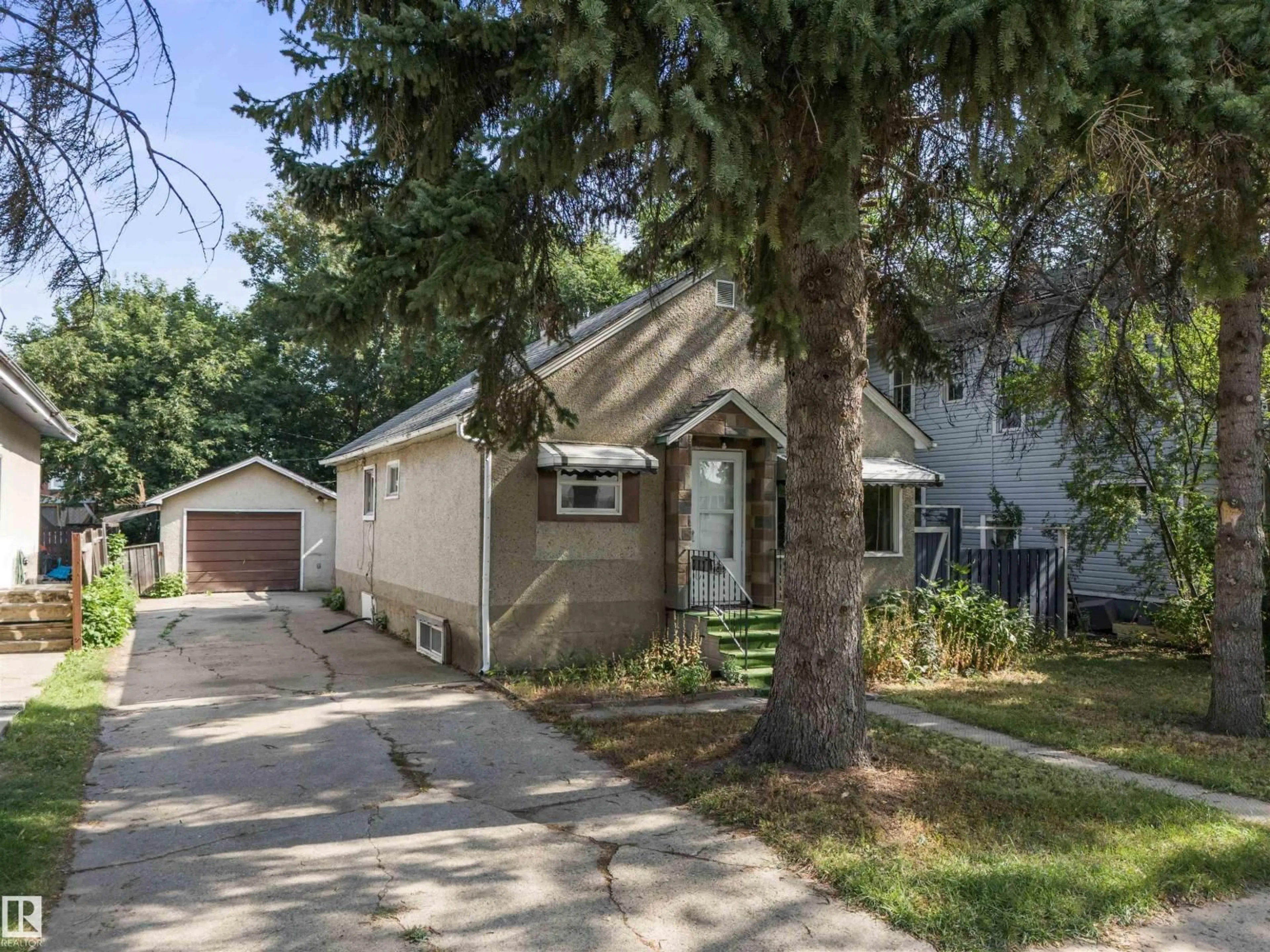 Home with vinyl exterior material, street for NW - 11819 45 ST, Edmonton Alberta T5W2T3