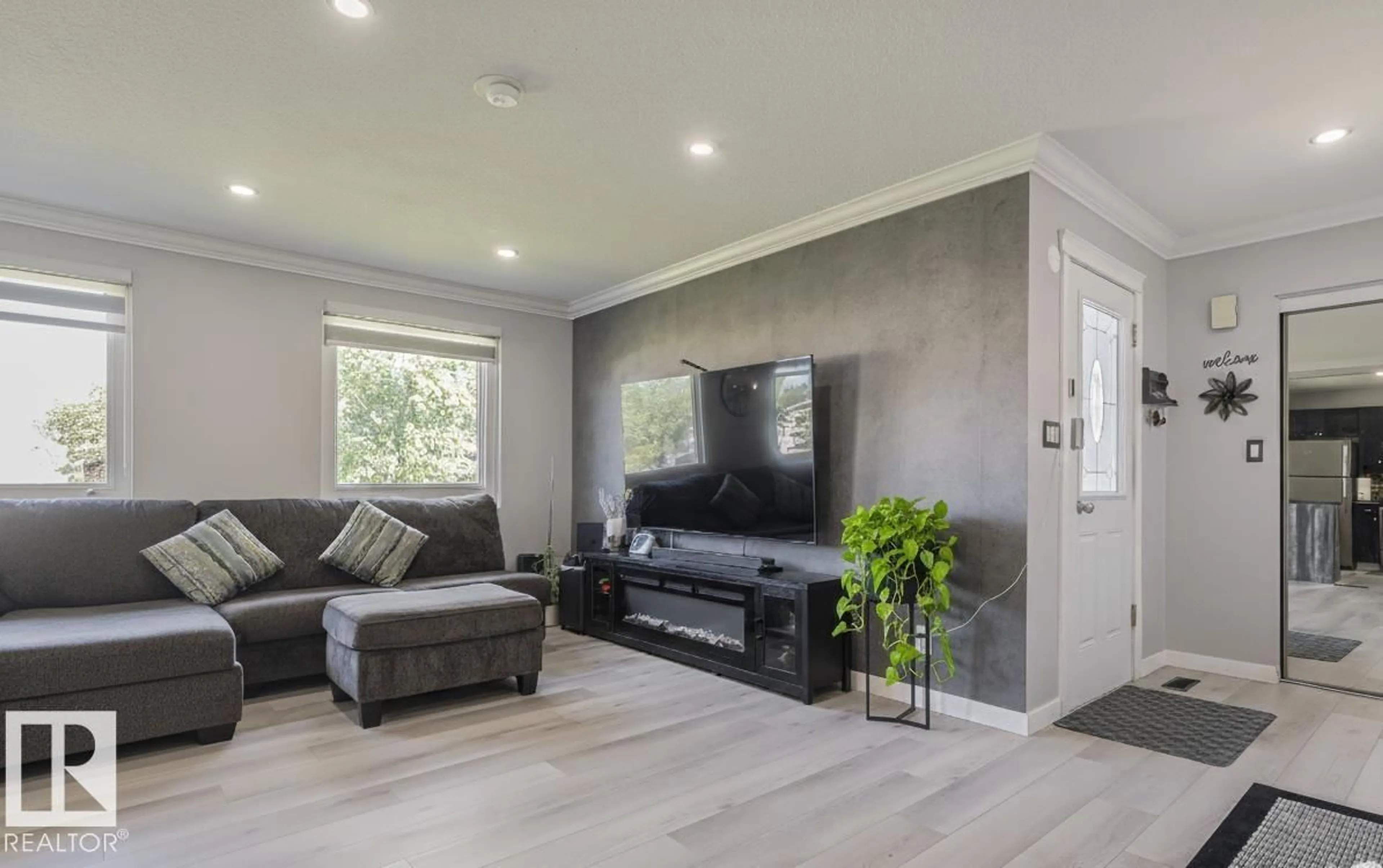 Living room with furniture, wood/laminate floor for 1016 56 ST, Edmonton Alberta T6L1Y3